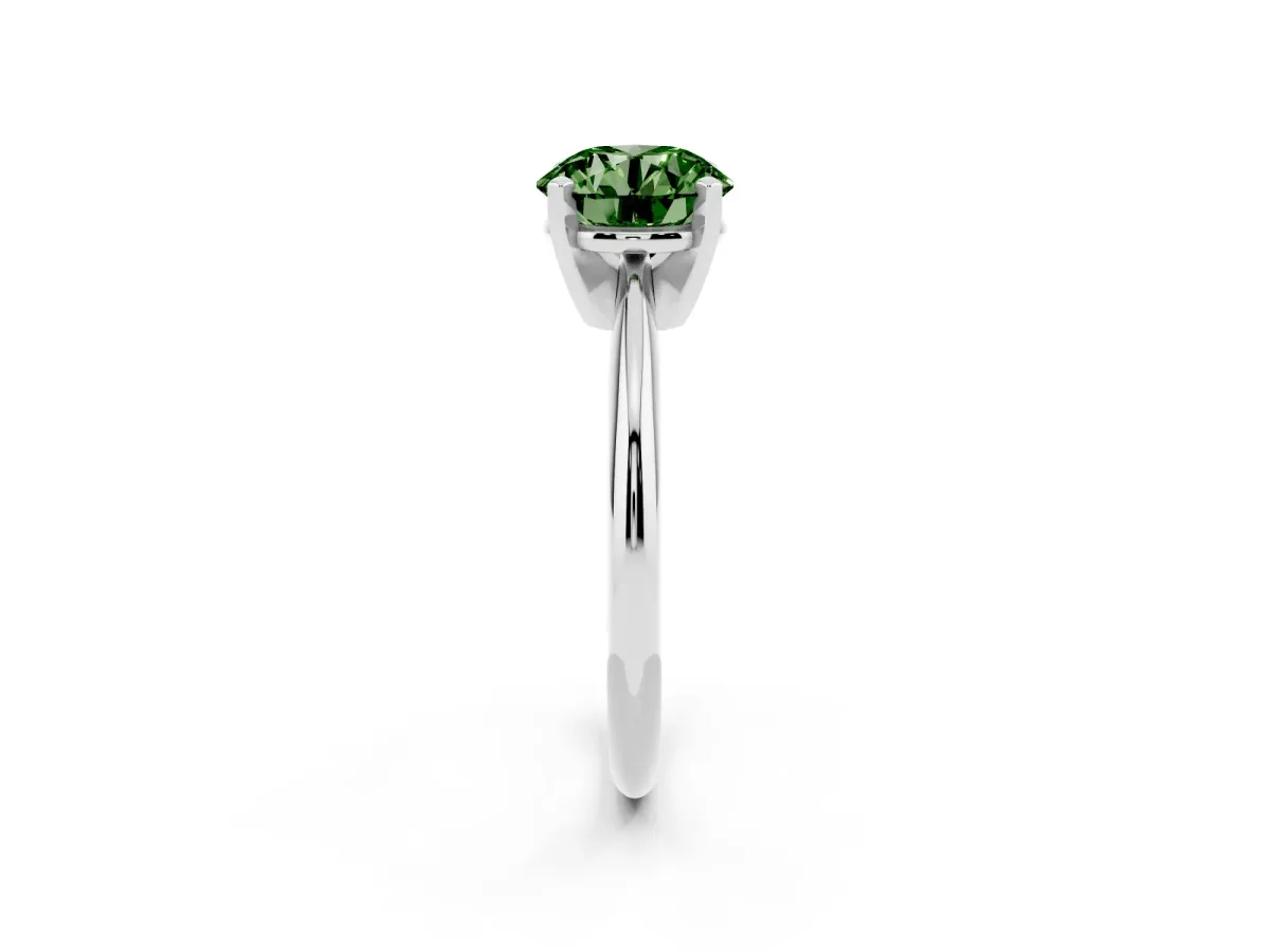 Fancy Green Round Cut Cut Solitaire Ring with Four-Prong Setting on a Classic Band Silver