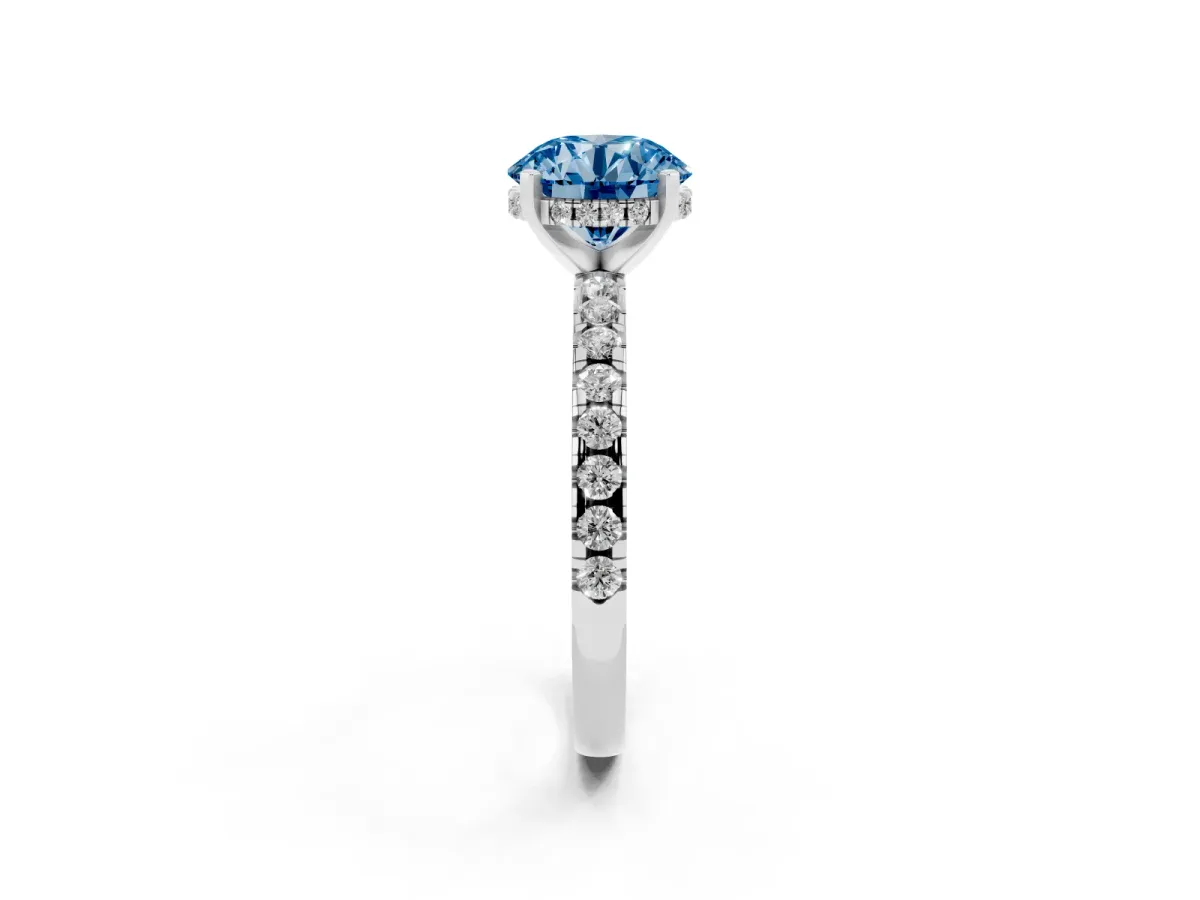 Fancy Blue Round Cut Diamond Solitaire Ring with Round Pavé Band and Four-Prong Setting Silver