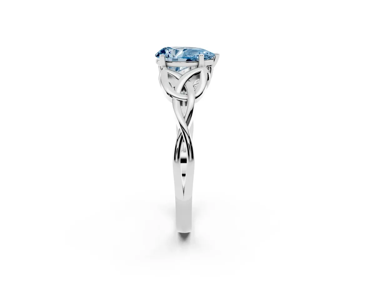 Fancy Blue Pear Cut Diamond Solitaire Engagement Ring with Celtic Knot Band and Four-Prong Setting Silver