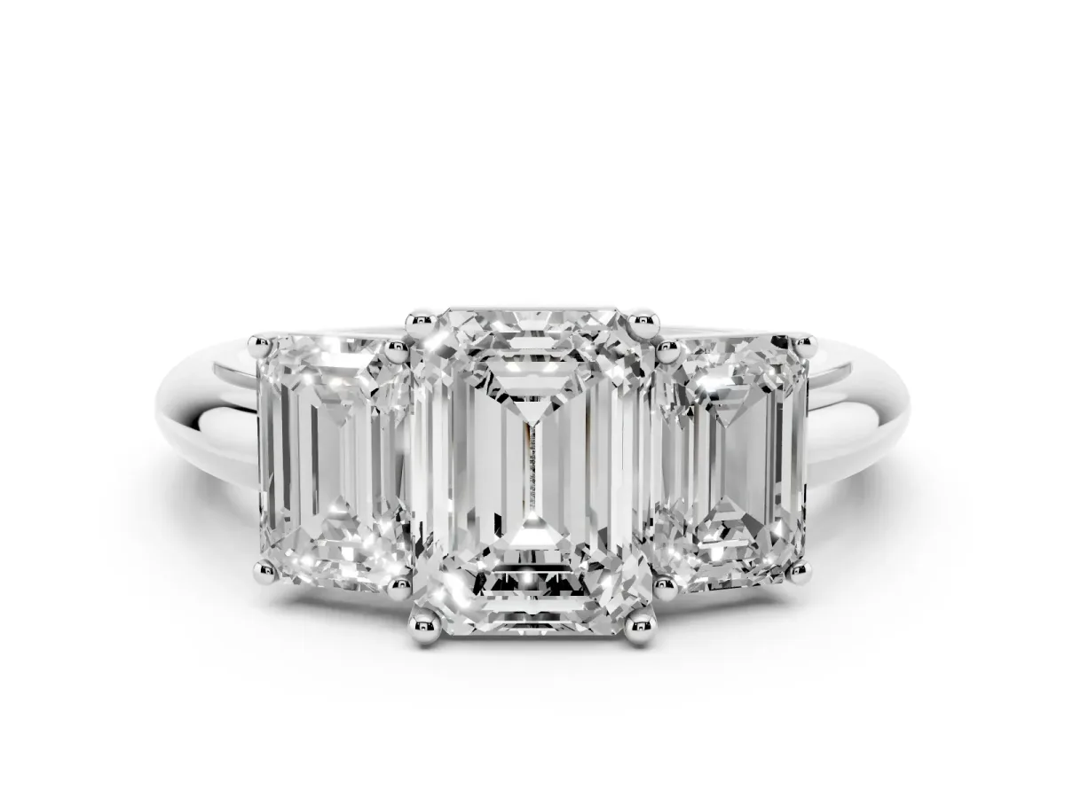 Three-Stone Emerald Cut Cut Diamond Engagement Ring with Prong Setting on a White Gold Band Platinum