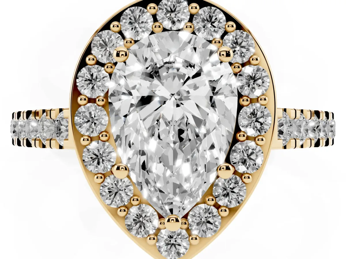 Pear Cut Diamond Halo Ring with Round Pavé Split Shank and Prong Setting Yellow gold
