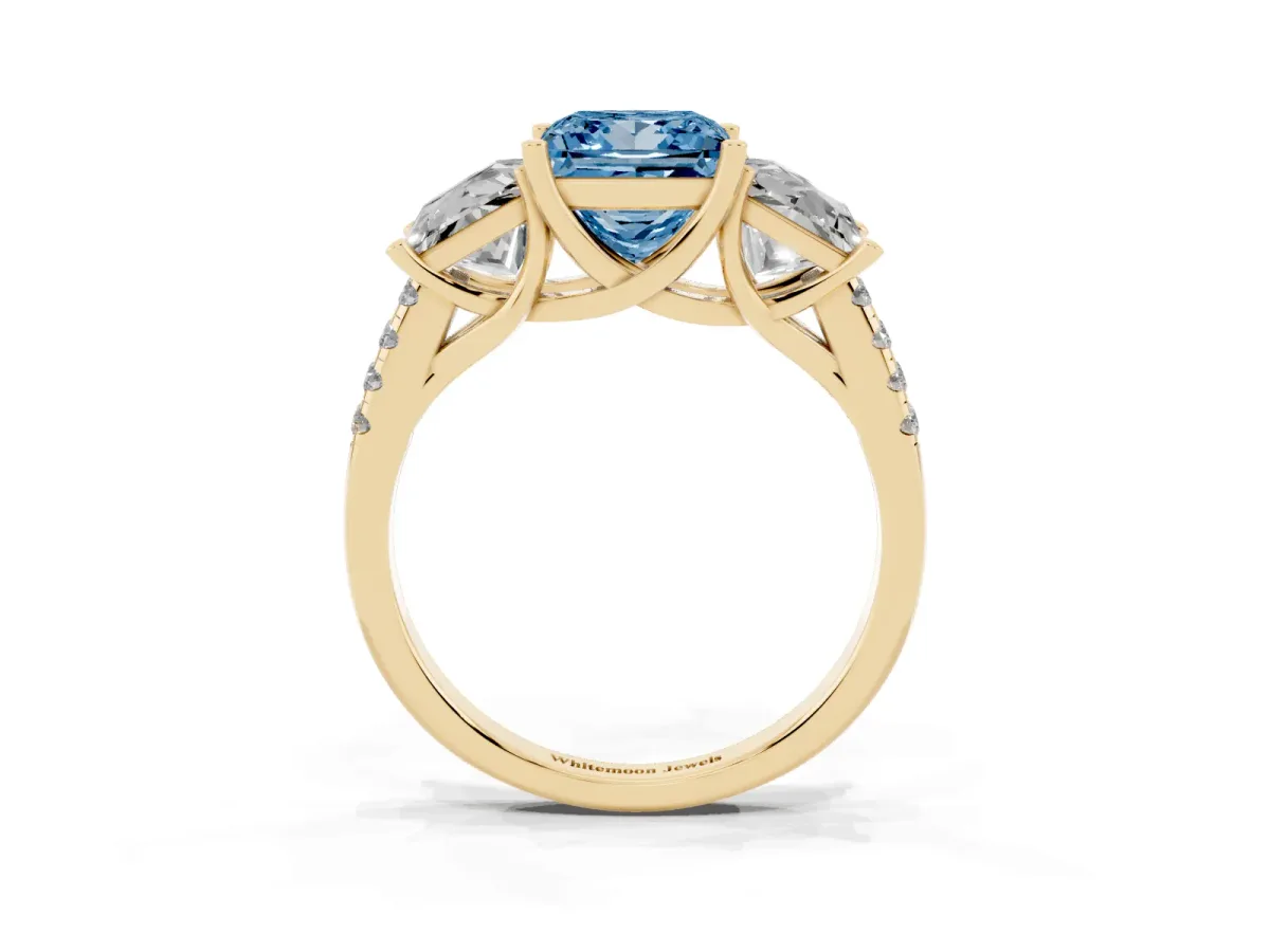 Fancy Blue Three-Stone Princess Cut Diamond Ring with Round Pavé Band and Prong Setting Yellow gold