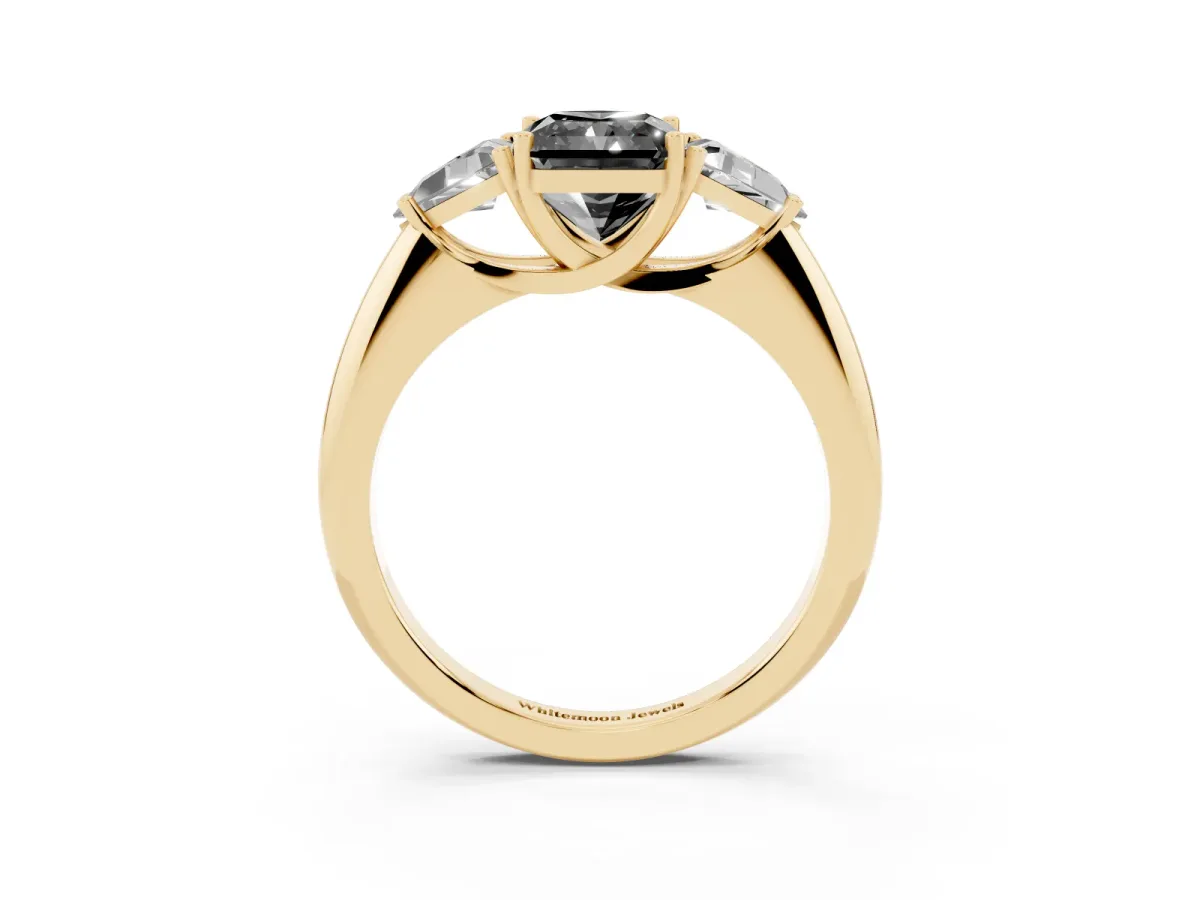 Fancy Black Three-Stone Radiant Cut Diamond Engagement Ring with Trillion Side Stones and Prong Setting Yellow gold
