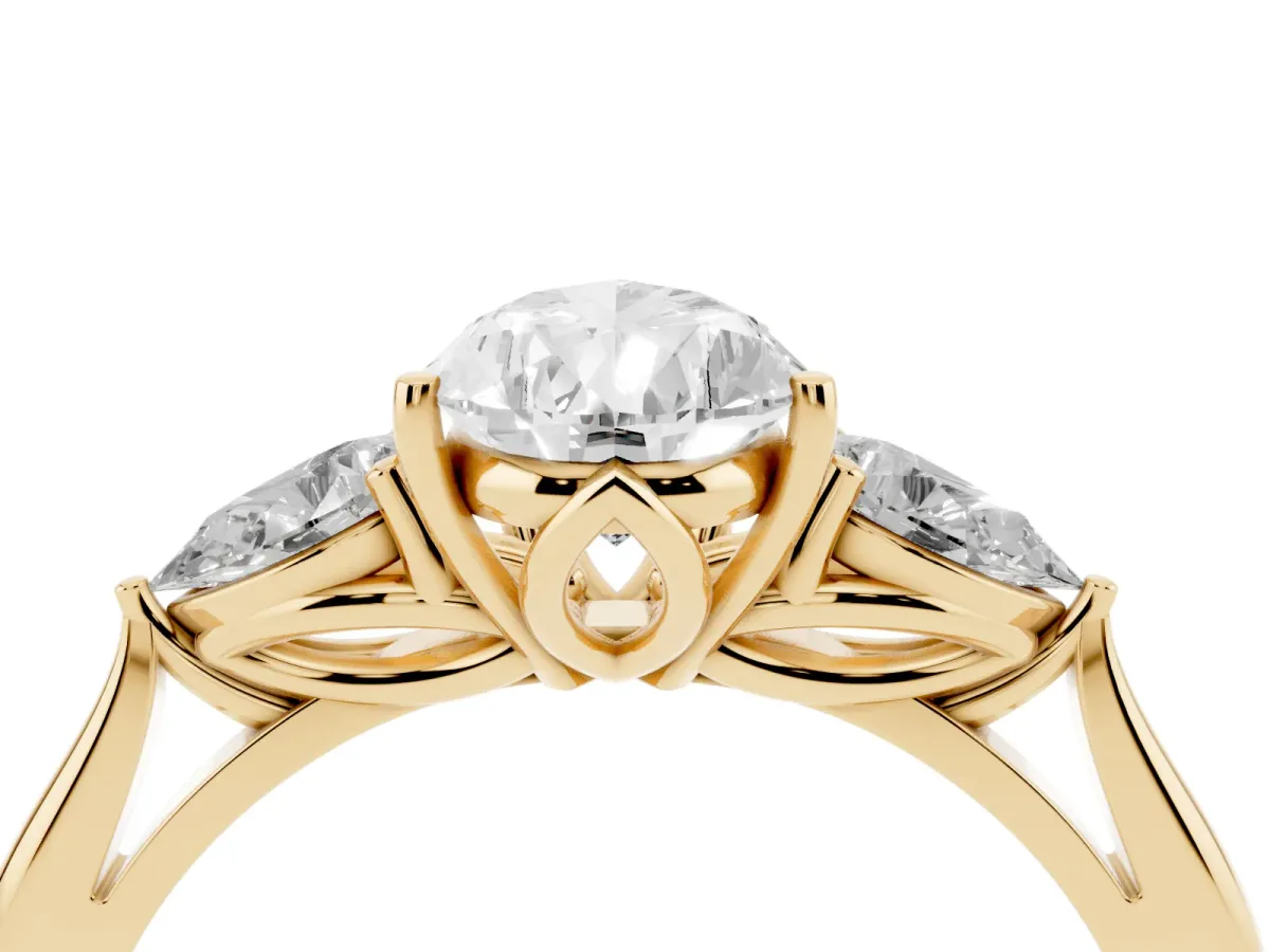 Three-Stone Pear Cut Diamond Ring with Pear Side Stones in Four-Prong Setting Yellow gold