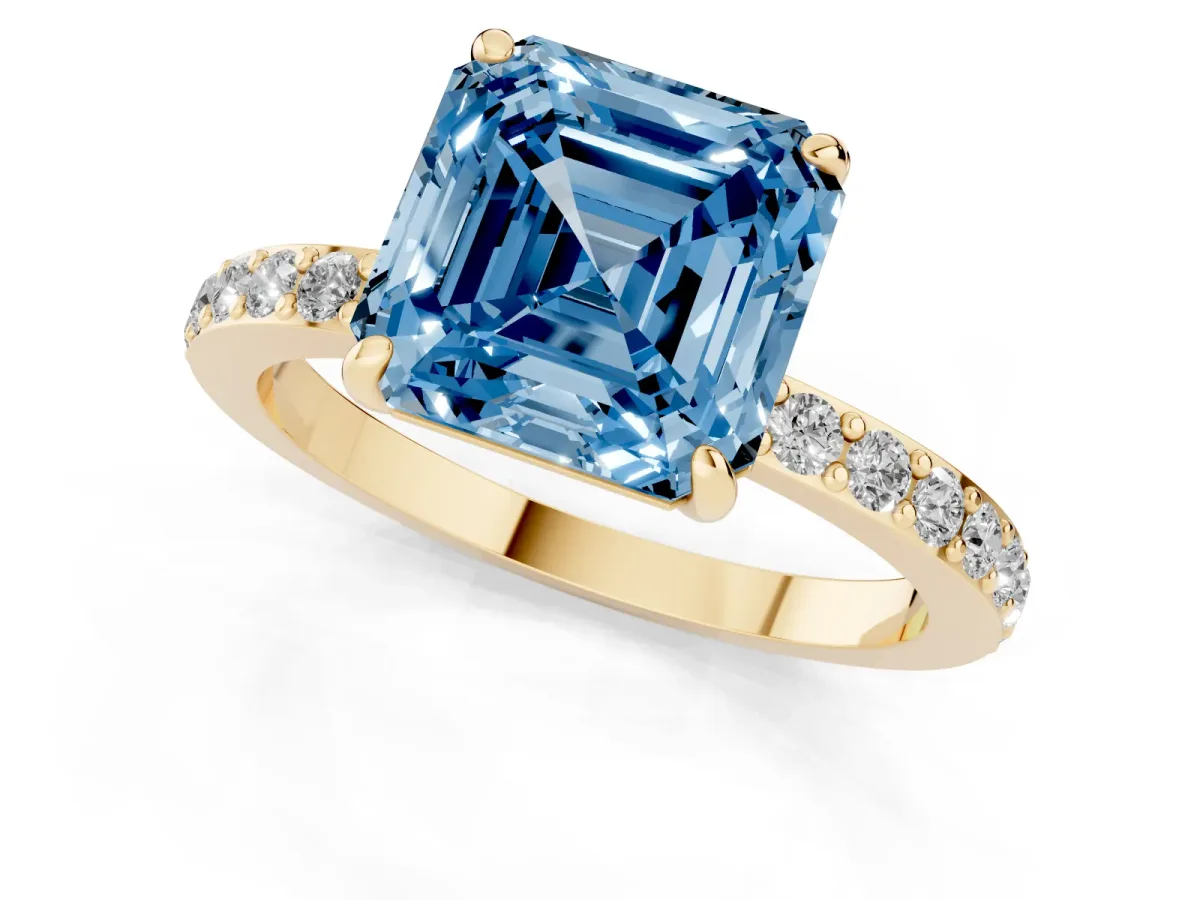 Fancy Blue Asscher Cut Diamond Solitaire Engagement Ring with Pavé Band and Four-Prong Setting Yellow gold