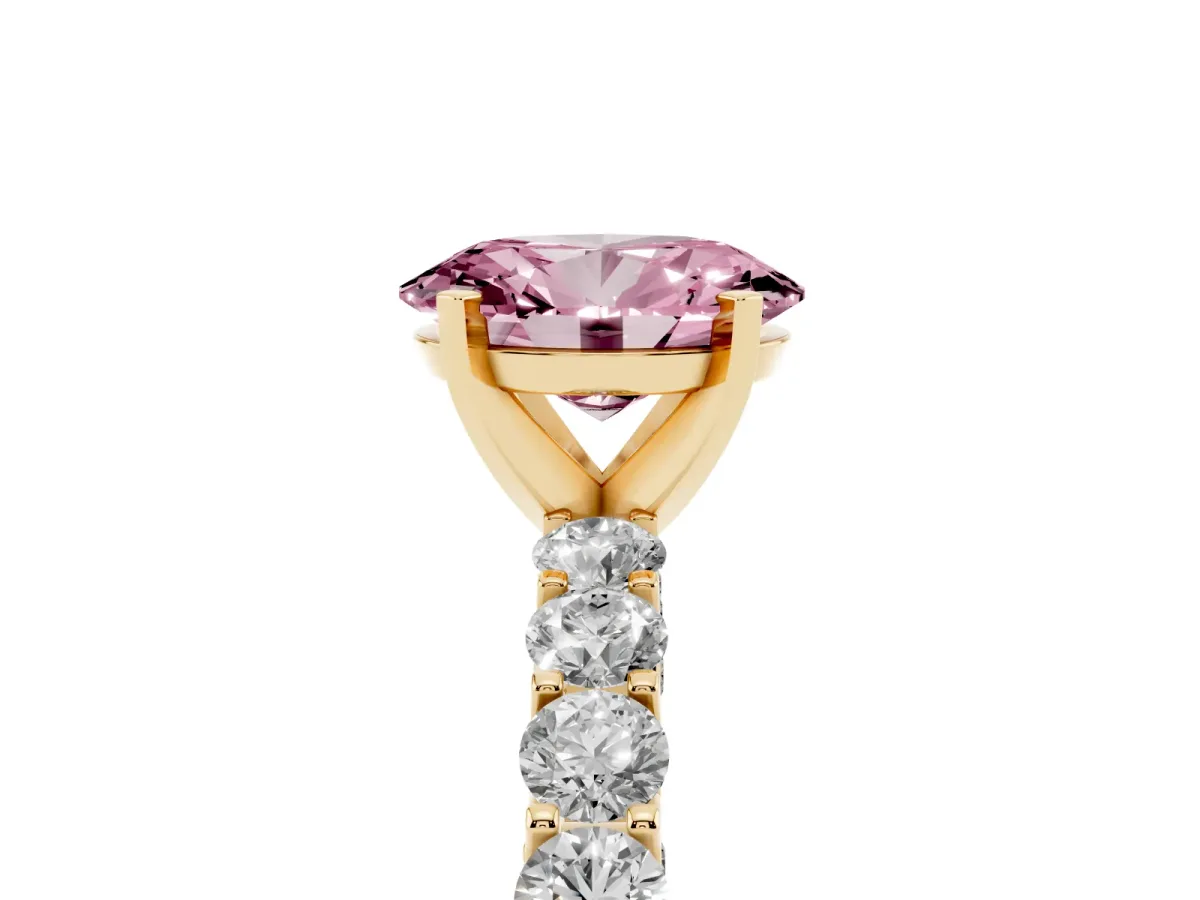 Fancy Pink Oval Cut Diamond Solitaire Ring with Shared Prong Pavé Band and Four-Prong Setting Yellow gold