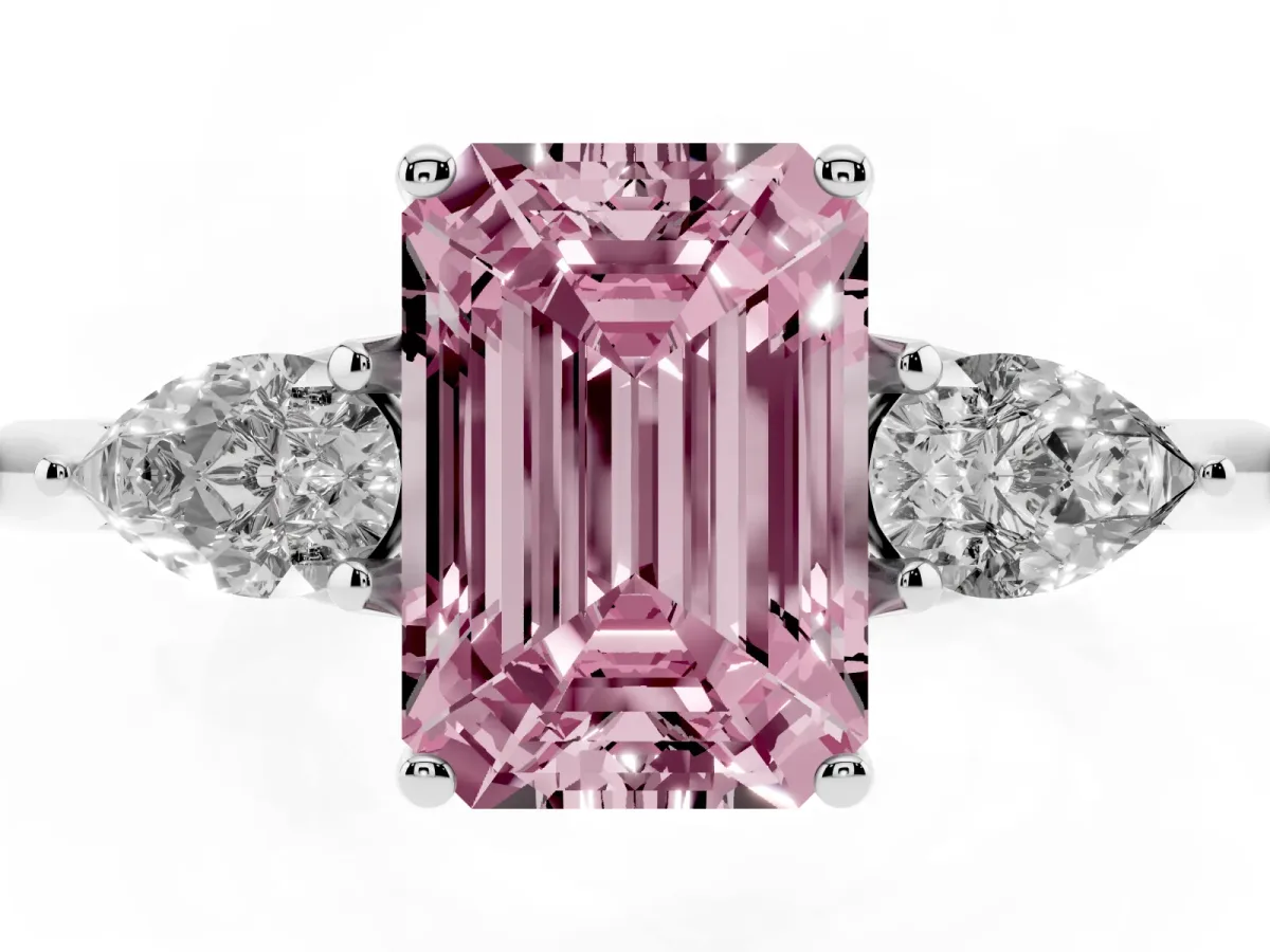 Fancy Pink Three-Stone Emerald Cut Diamond Ring with Pear Side Stones in Four-Prong Setting Platinum