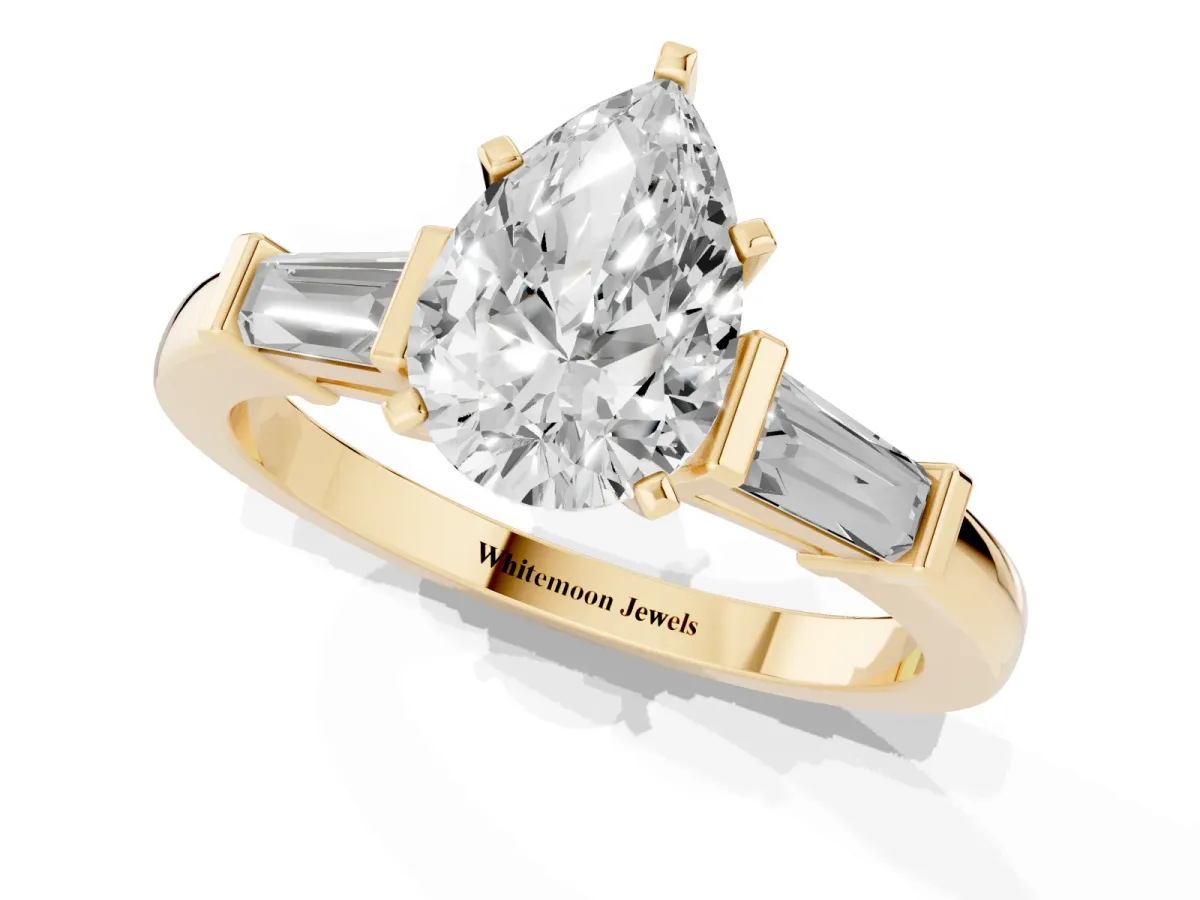Pear Cut Cut Diamond Solitaire Ring with Tapered Baguette Accents and Four-Prong Setting Yellow gold
