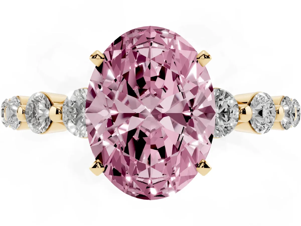 Fancy Pink Oval Cut Solitaire Diamond Ring with Pave Band and Four-Prong Setting Yellow gold