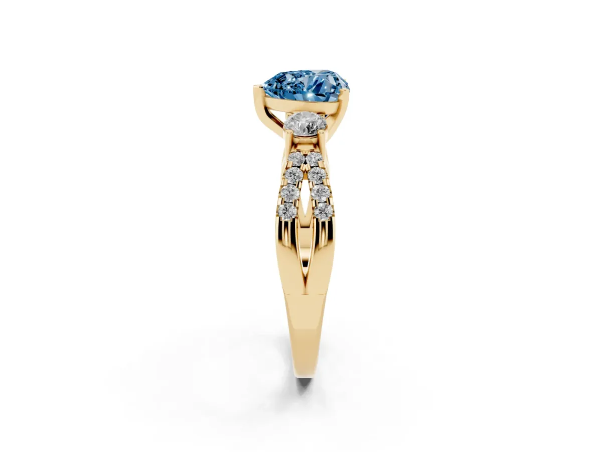 Fancy Blue Heart Cut Diamond Three-Stone Ring with Pavé Split Shank and Four-Prong Setting Yellow gold