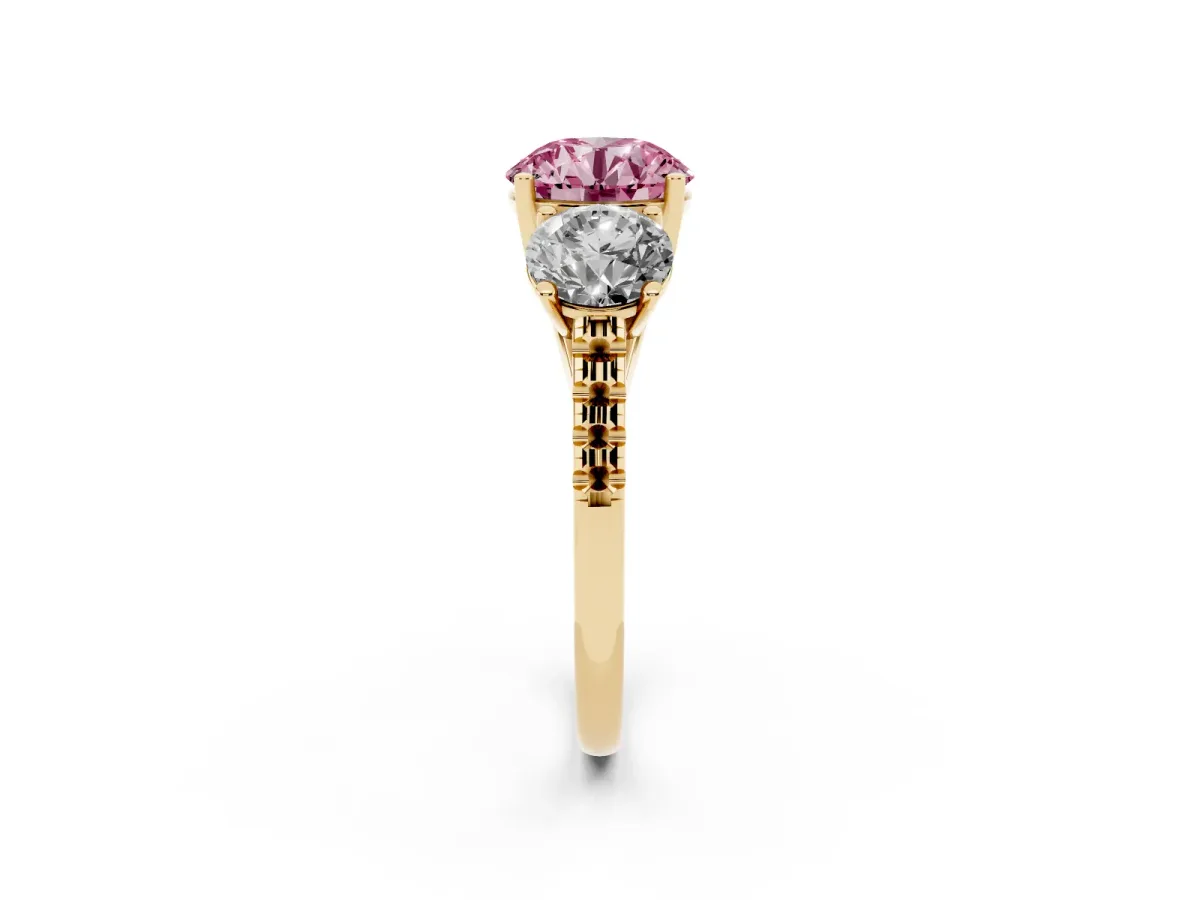 Fancy Pink Three-Stone Round Cut Diamond Ring with Round Pavé Band and Prong Setting Yellow gold