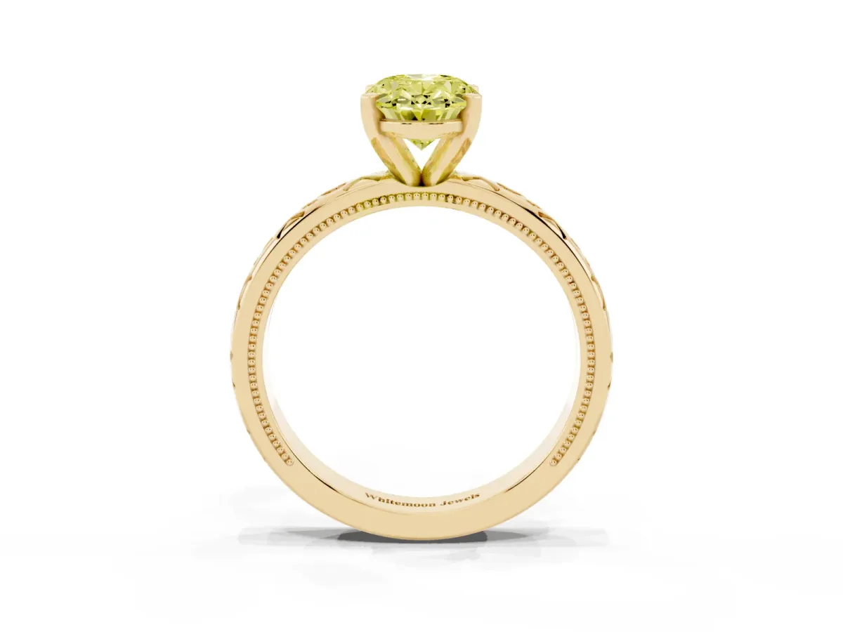 Fancy Yellow Oval Cut Solitaire Engagement Ring with Scrollwork Band and Four-Prong Setting Yellow gold