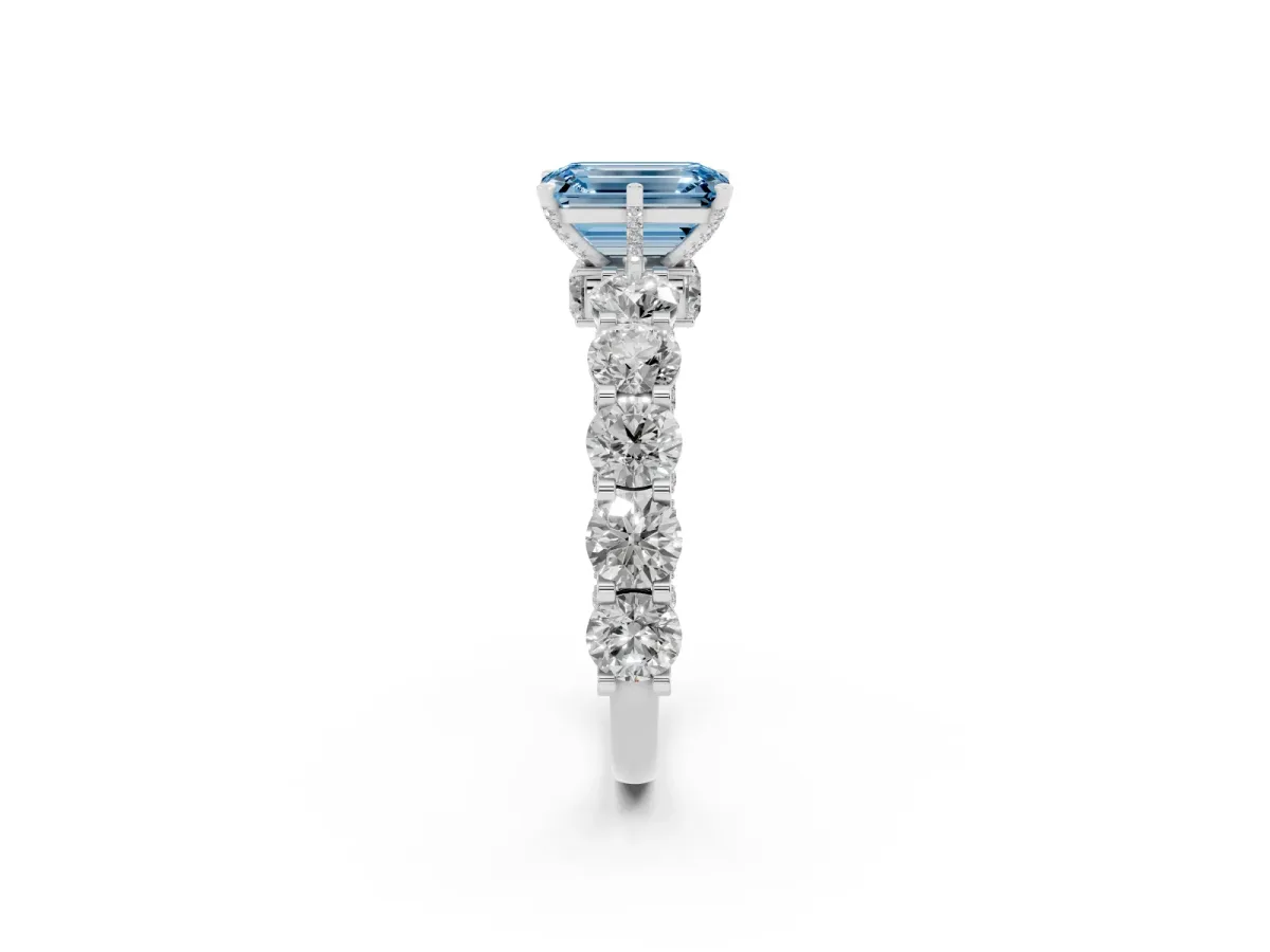 Fancy Blue Emerald Cut Diamond Side Stone Engagement Ring with Four-Prong Setting Silver