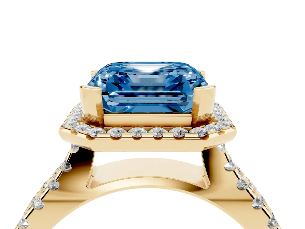Fancy Blue Asscher Cut Diamond Halo Ring with Split Shank Pavé Band and Prong Setting Yellow gold
