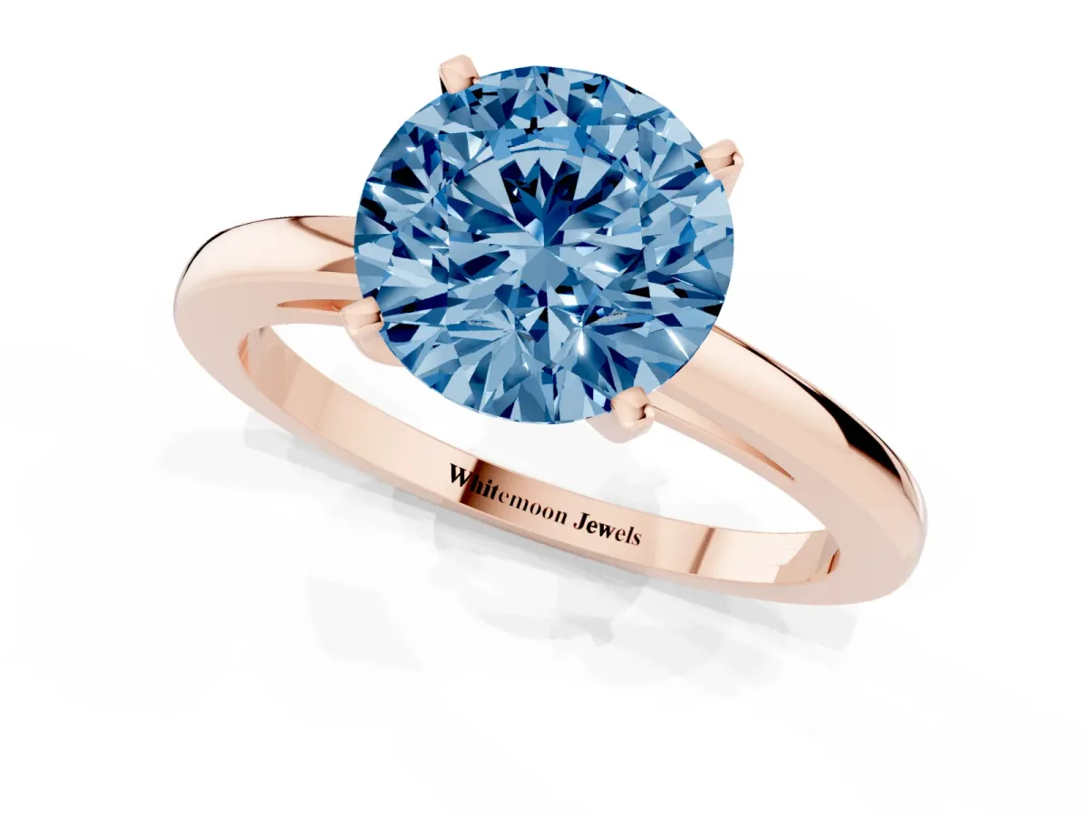 Fancy Blue Round Cut Solitaire Diamond Engagement Ring with Four-Prong Setting on a Classic Band Rose gold
