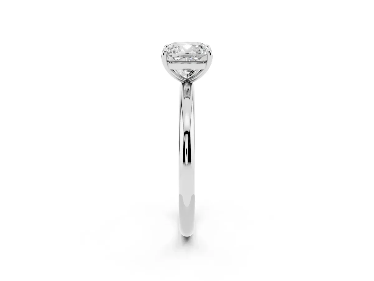 Cushion Cut Solitaire Diamond Ring with Four-Prong Setting on a Plain Band Platinum