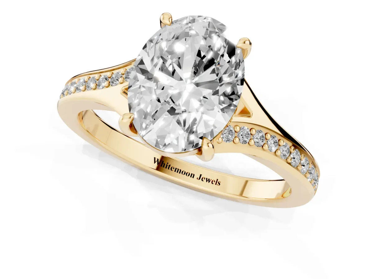 Oval Cut Diamond Solitaire Ring with Pavé Band and Prong Setting Yellow gold