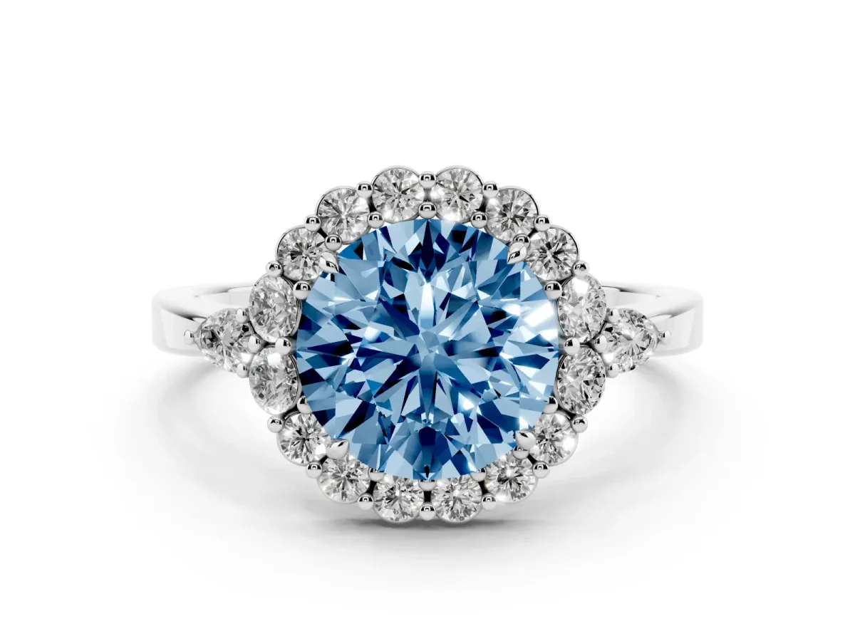 Fancy Blue Round Cut Diamond Halo Ring with Pear Side Stones and Prong Setting Silver
