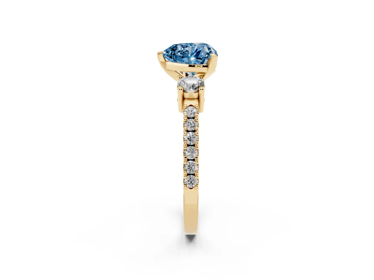 Fancy Blue Heart Cut Three-Stone Diamond Pavé Band with Prong Setting Yellow gold