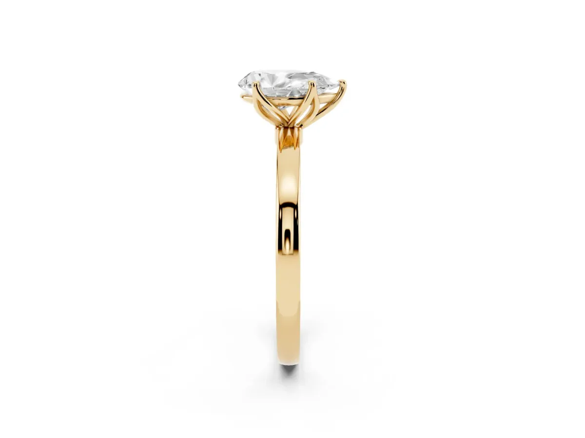Pear Cut Diamond Solitaire Ring with Thin Band and Prong Setting Yellow gold