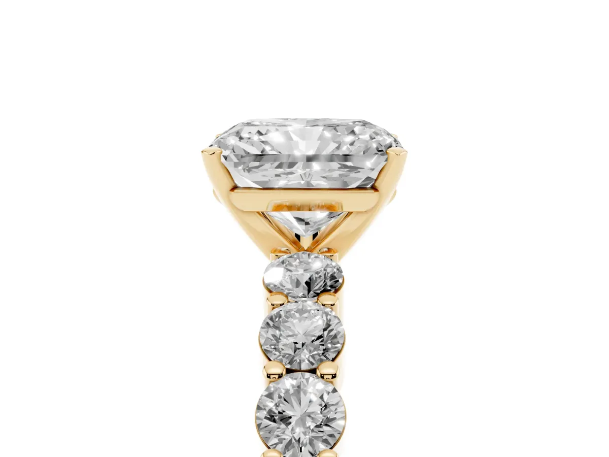 Radiant Cut Diamond Solitaire Ring with Shared Prong Round Side Stones Yellow gold