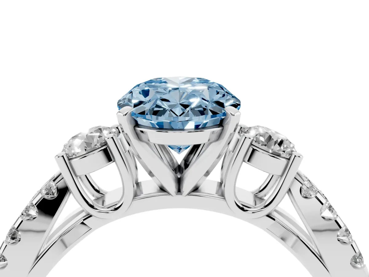 Fancy Blue Oval Cut Diamond Three-Stone Ring with Pavé Split Shank and Four-Prong Setting Silver