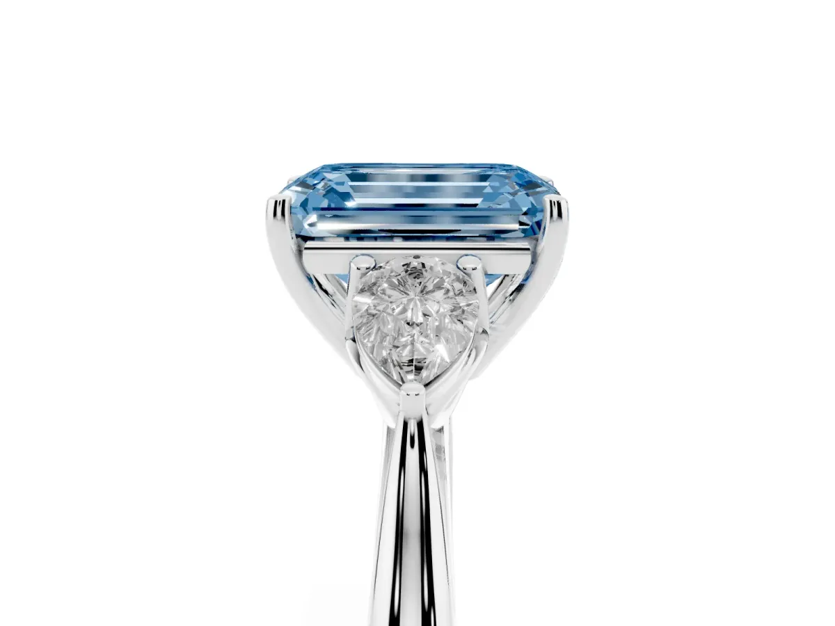 Fancy Blue Emerald Cut Diamond Three-Stone Ring with Pear Side Stones and Prong Setting Platinum