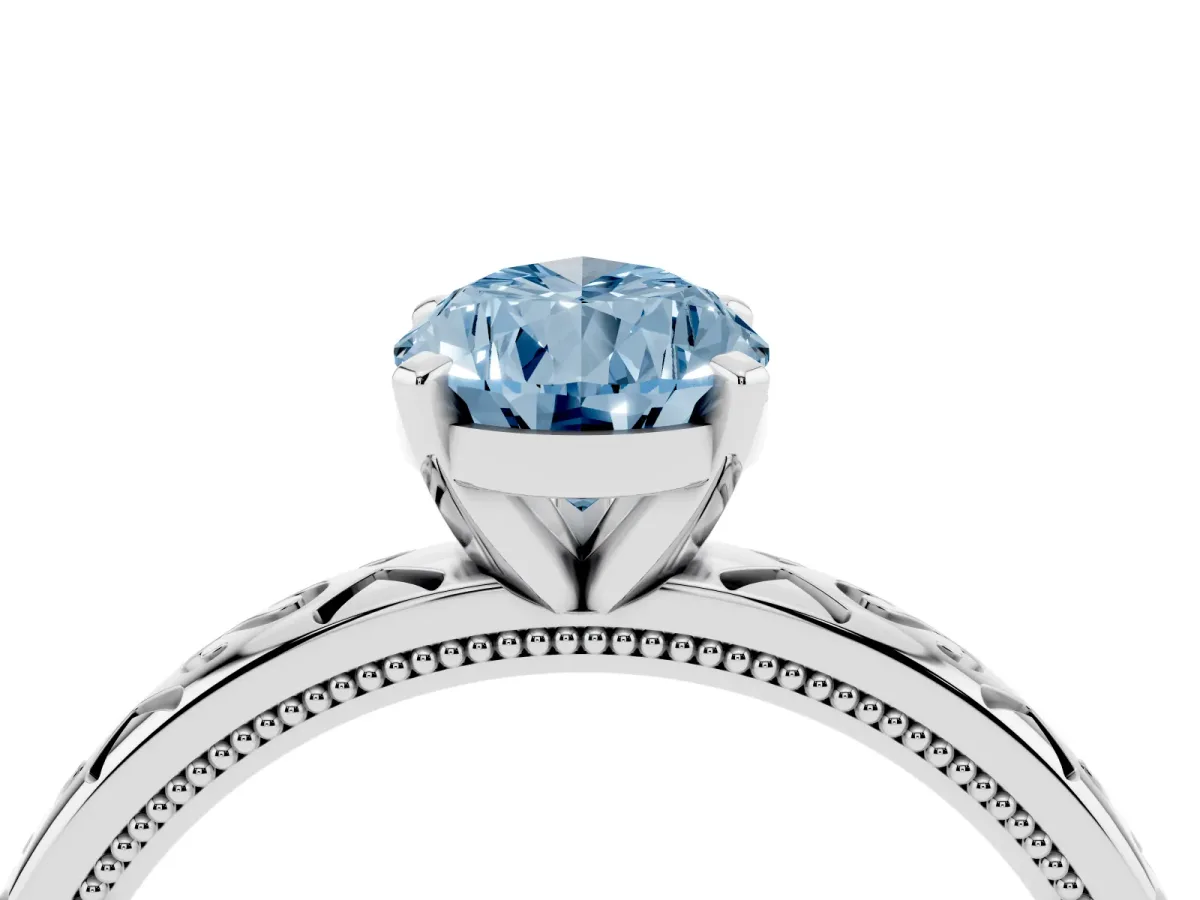 Fancy Blue Pear Cut Solitaire Engagement Ring with Scrollwork Band and Four-Prong Setting Silver