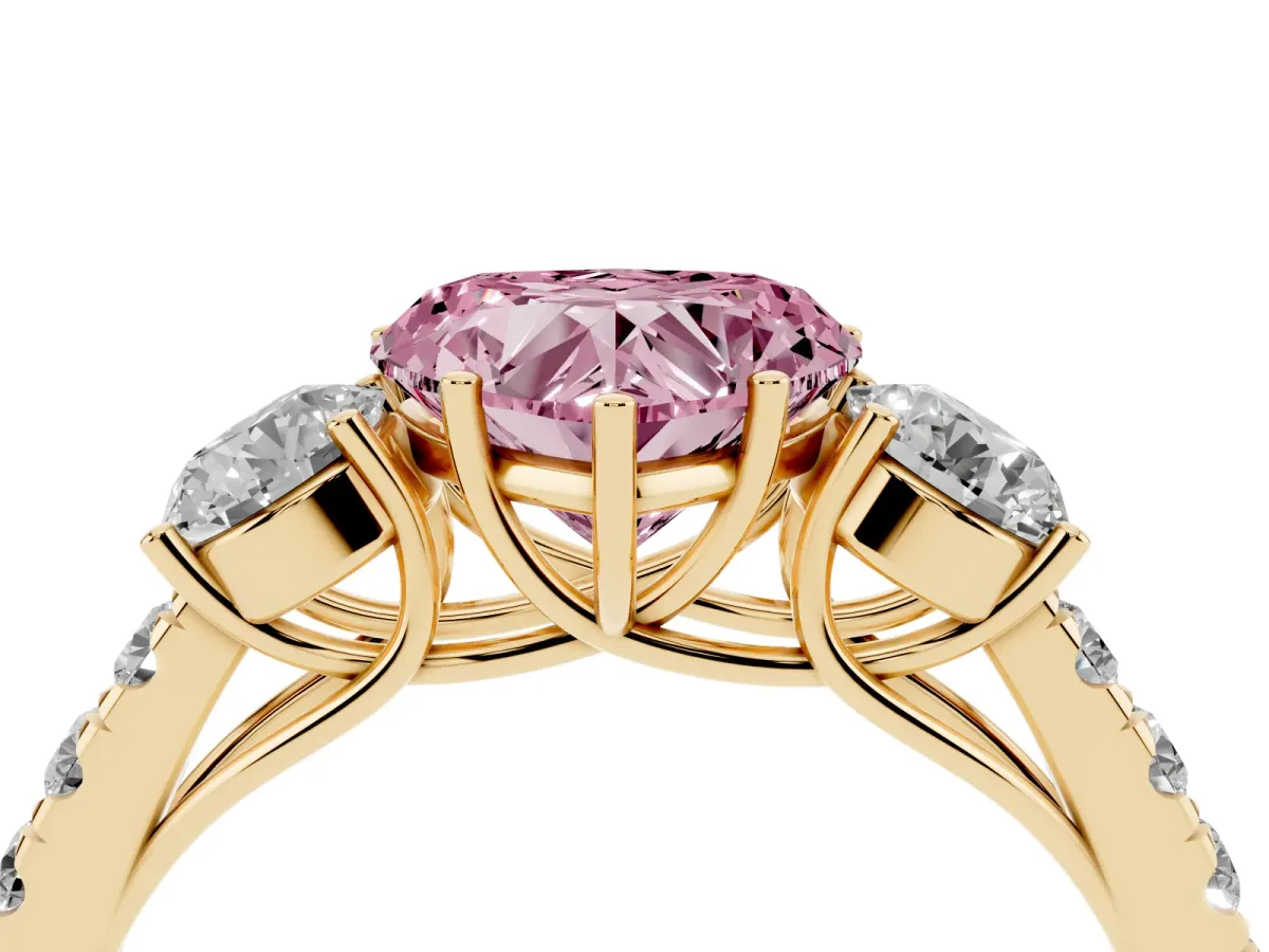Fancy Pink Heart Cut Cut Diamond Three-Stone Ring with Round Side Stones and Pavé Band Yellow gold