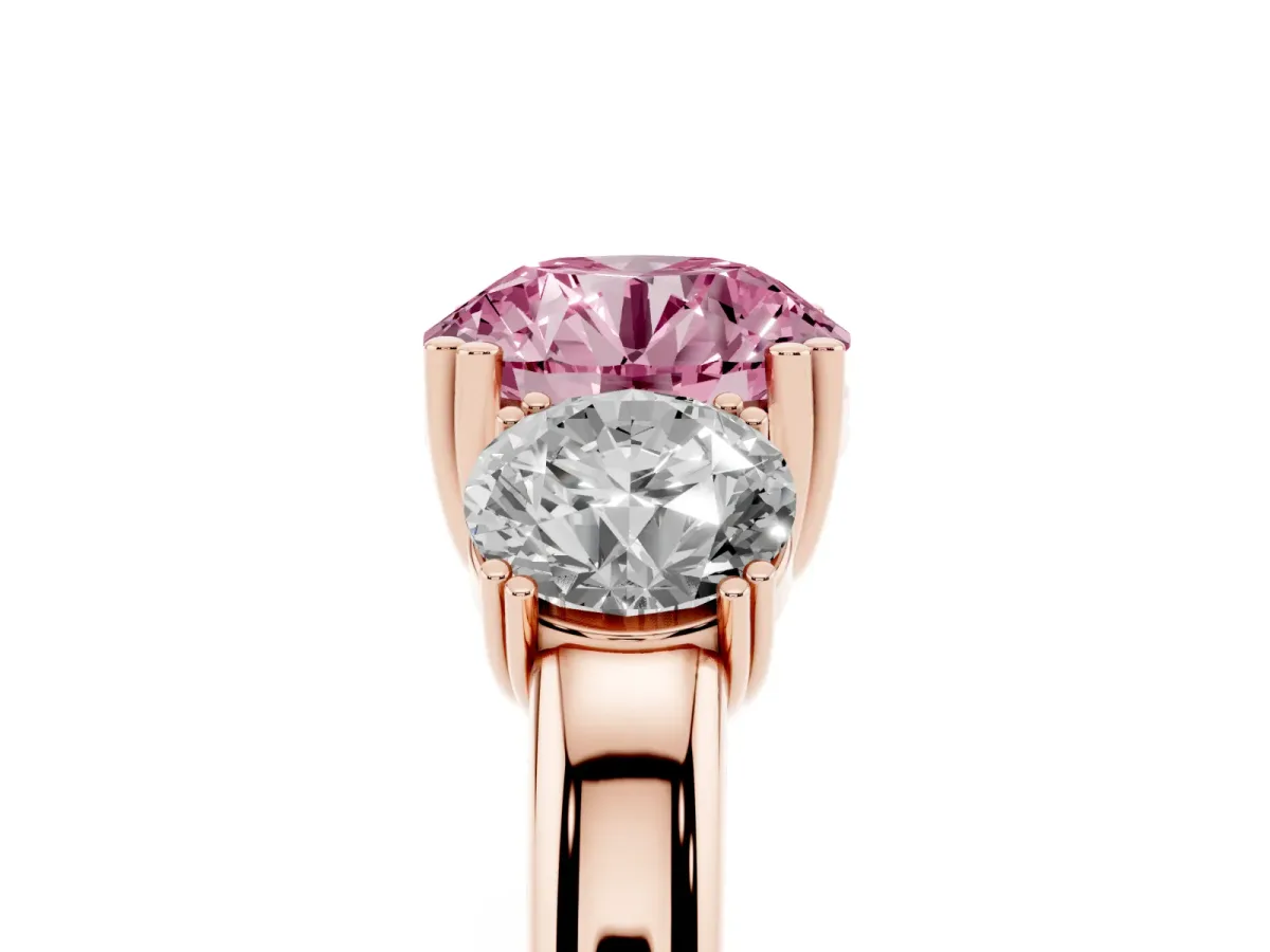 Fancy Pink Three-Stone Round Cut Cut Diamond Ring with Channel Set Band and Four-Prong Setting Rose gold