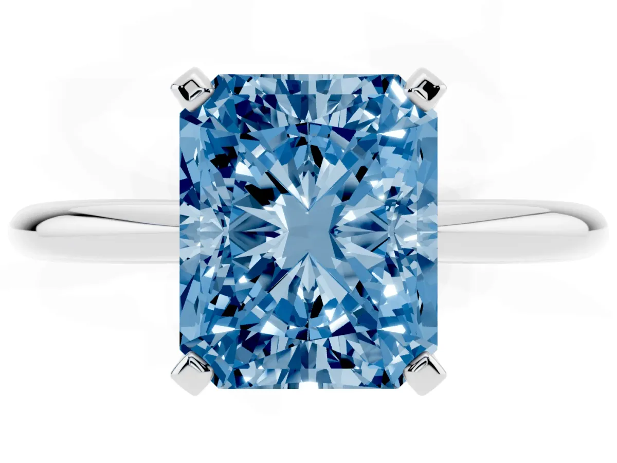 Fancy Blue Radiant Cut Diamond Solitaire Ring with Prong Setting and Classic Band Platinum