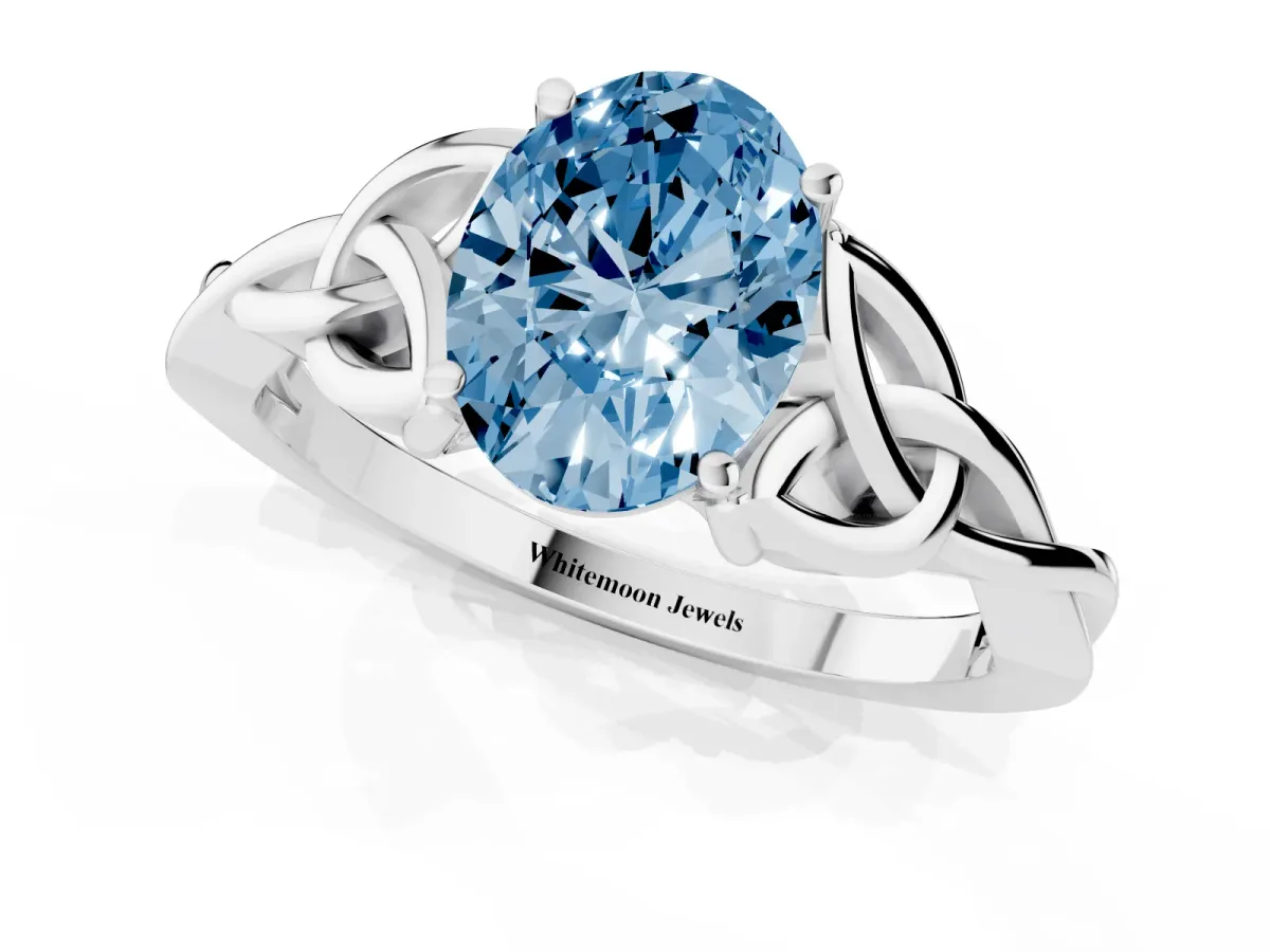 Fancy Blue Oval Cut Diamond Solitaire Engagement Ring with Celtic Knot Band and Four-Prong Setting Silver