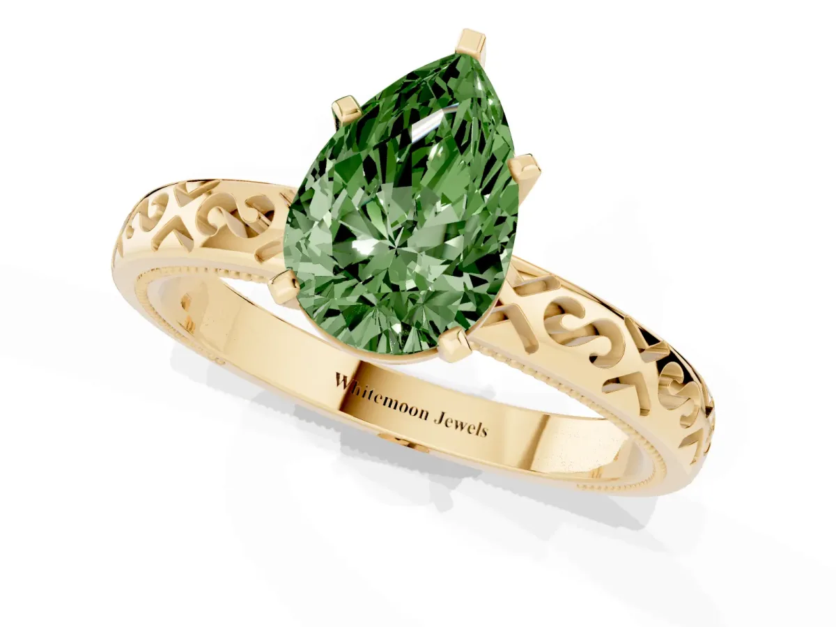 Fancy Green Pear Cut Solitaire Engagement Ring with Scrollwork Band and Four-Prong Setting Yellow gold