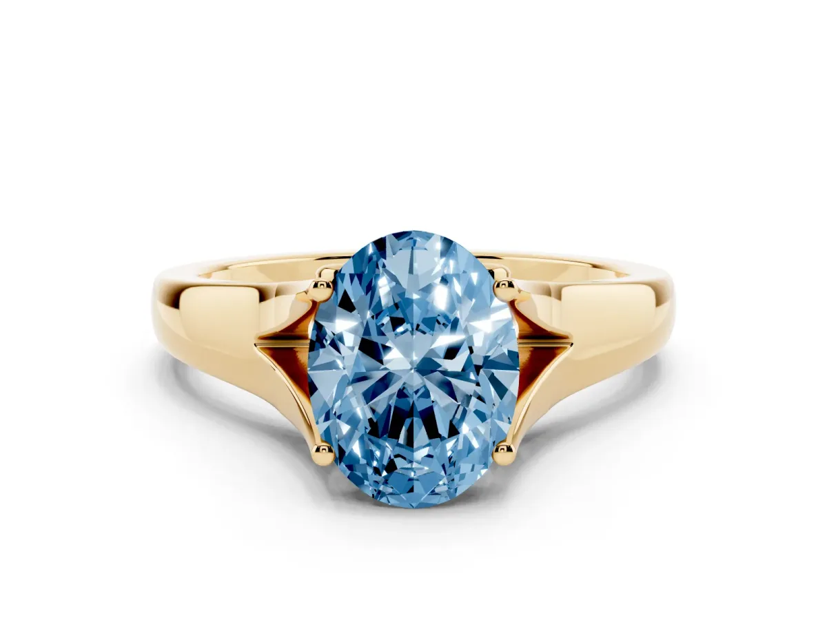 Fancy Blue Oval Cut Solitaire Diamond Ring with Cathedral Band and Four-Prong Setting Yellow gold