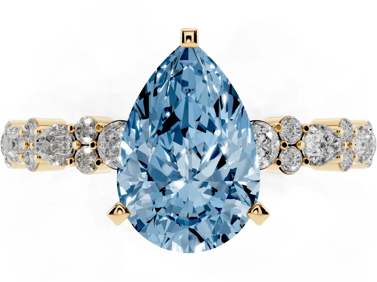 Fancy Blue Pear Cut Diamond Side Stone Solitaire Ring with Round and Four-Prong Setting Yellow gold