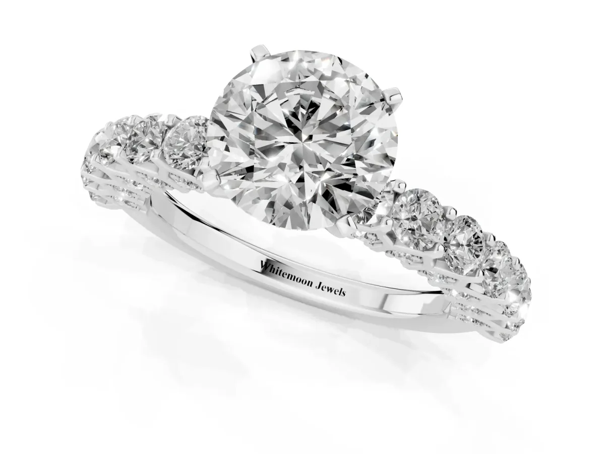Round Cut Diamond Solitaire Ring with Shared Prong Pavé Band and Four-Prong Setting Silver