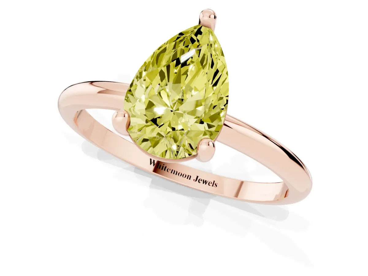 Fancy Yellow Pear Cut Solitaire Diamond Ring with 4-Prong Setting on a Classic Band Rose gold