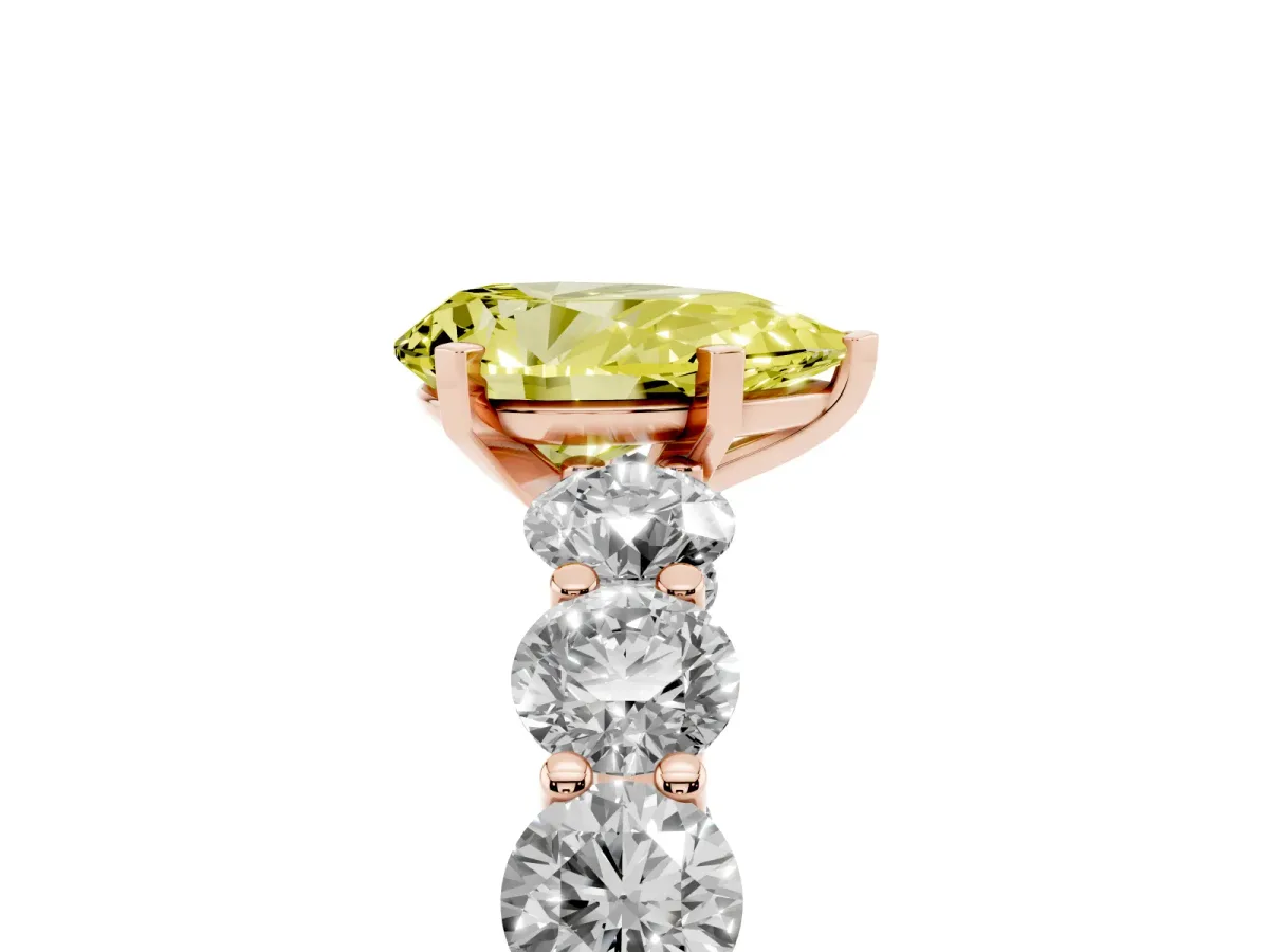 Fancy Yellow Pear Cut Diamond Prong Setting with Side Stones on a Pave Band Rose gold