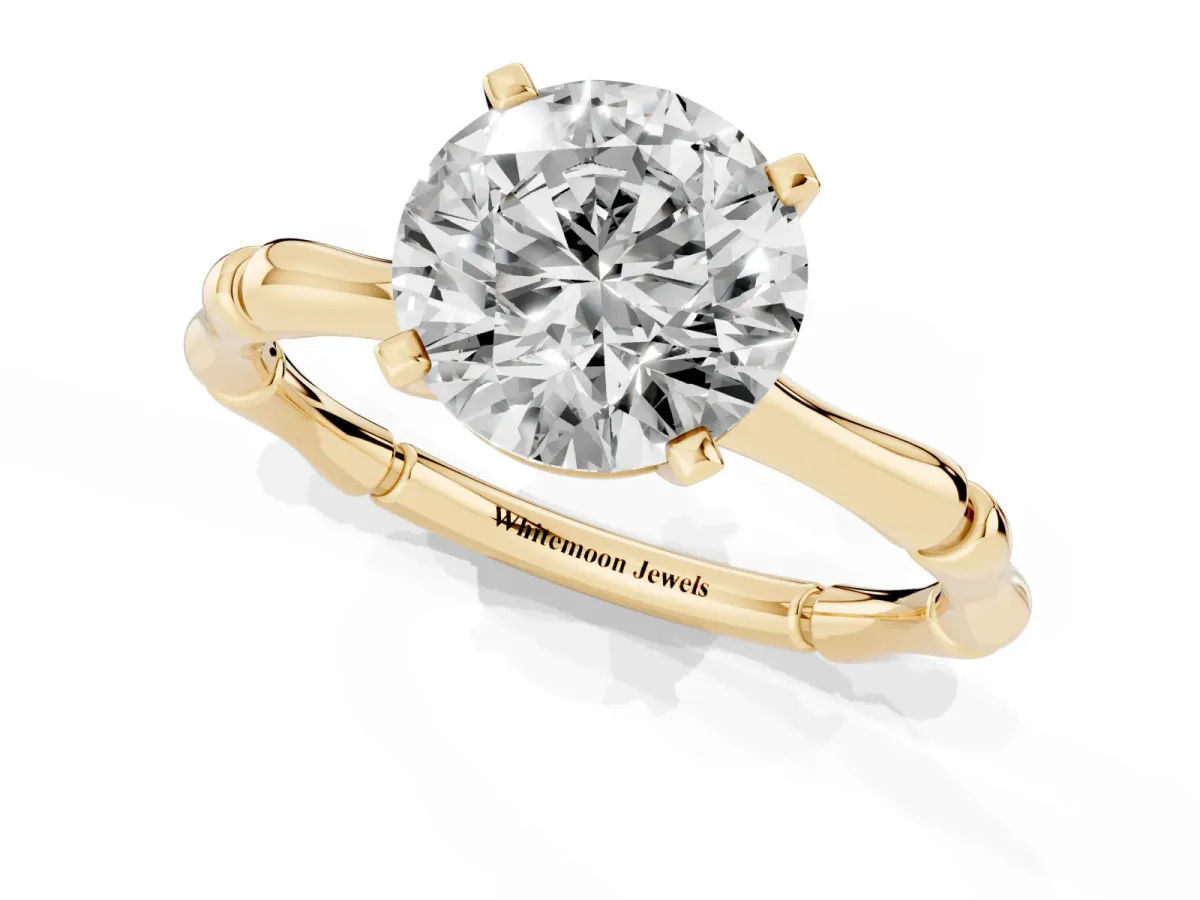 Round Cut Solitaire Diamond Ring with Bamboo Band and Four-Prong Setting Yellow gold