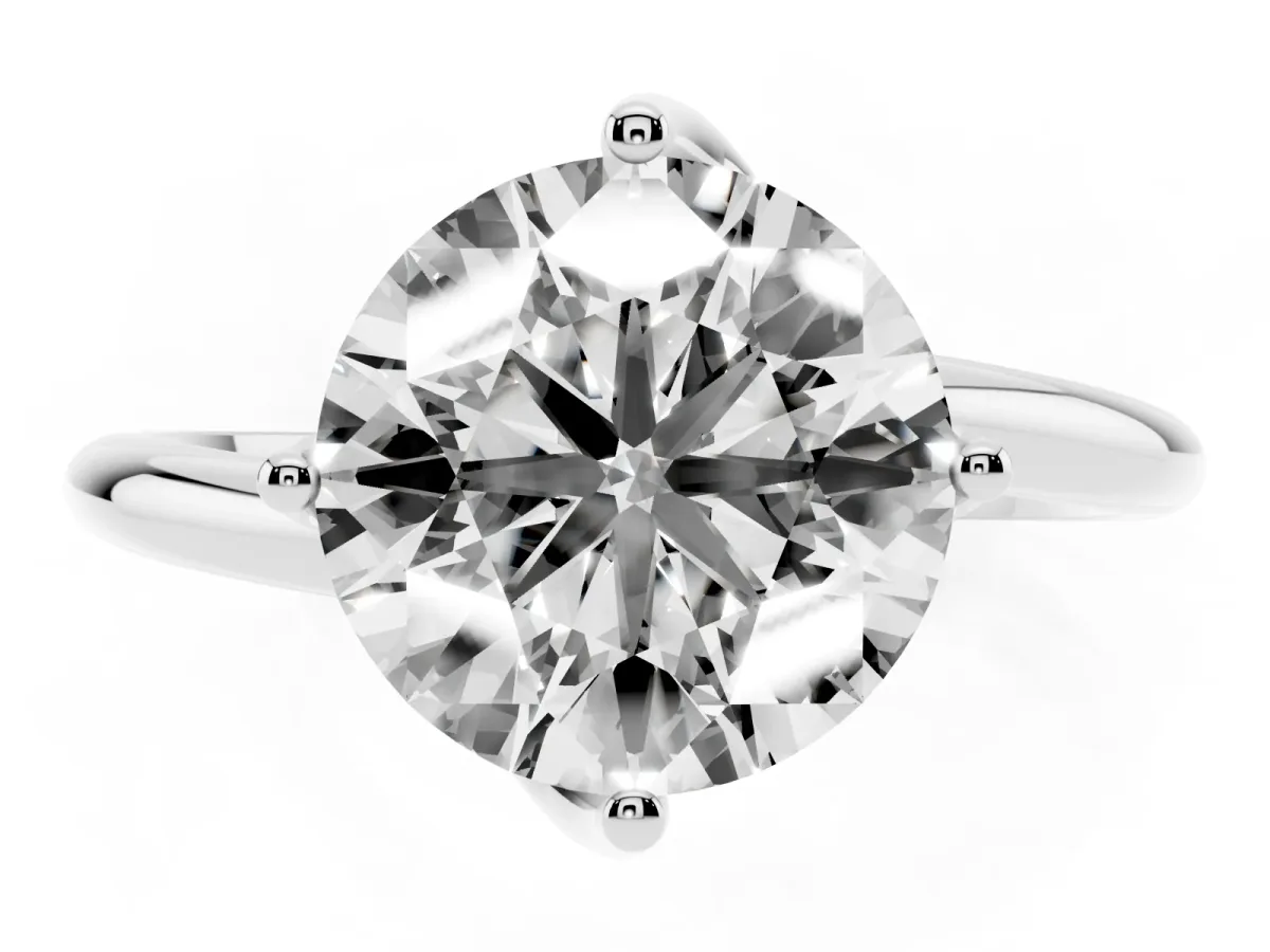 Round Cut Diamond Solitaire Engagement Ring with Four-Prong Setting and Classic Band Silver