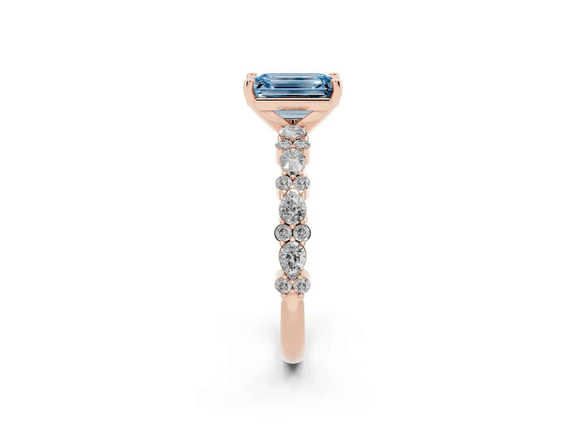 Fancy Blue Emerald Cut Diamond Side Stone Solitaire Ring with Round and Four-Prong Setting Rose gold