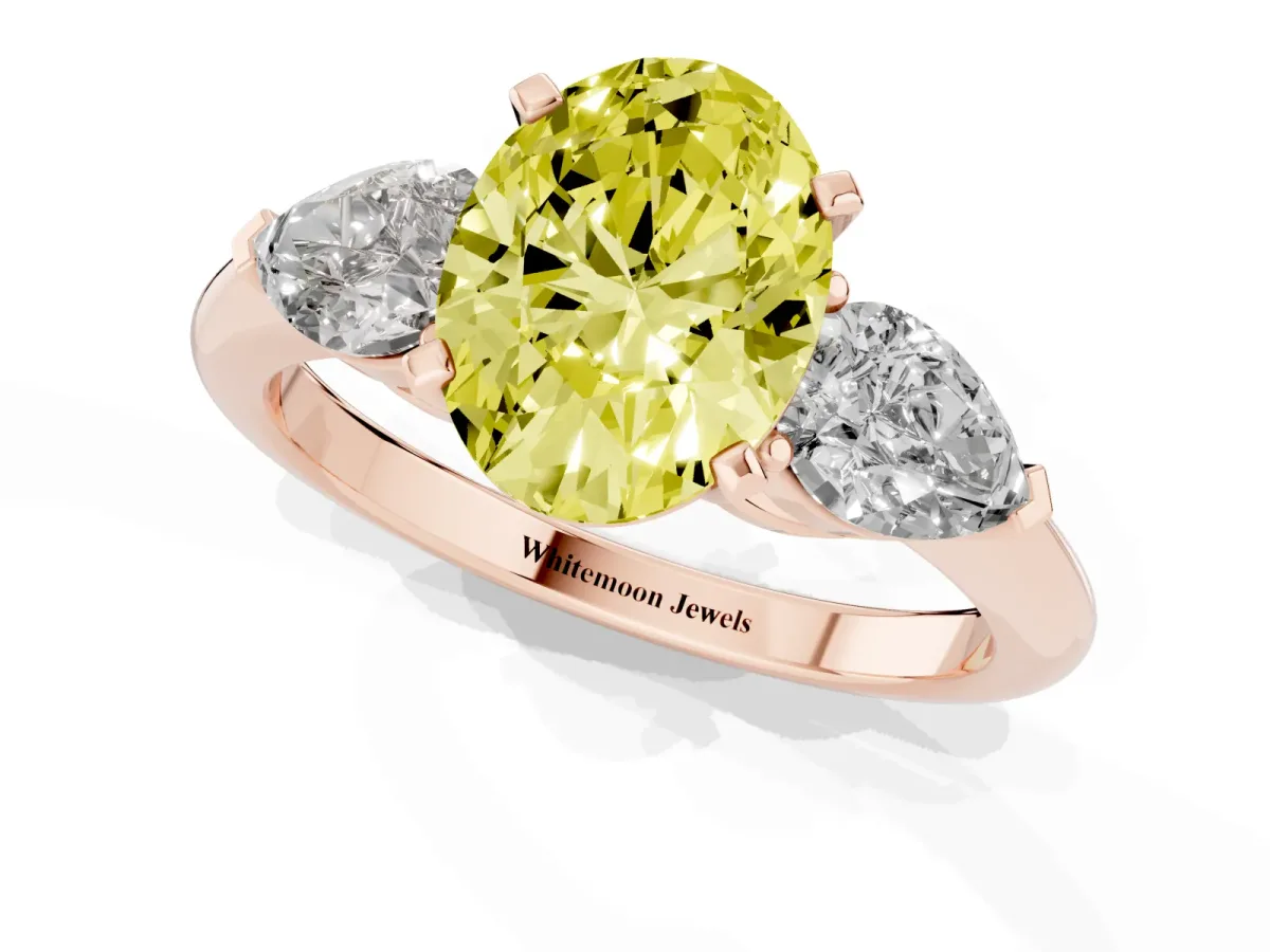 Fancy Yellow Three-Stone Oval Cut Diamond Ring with Pear Side Stones and Four-Prong Setting Rose gold