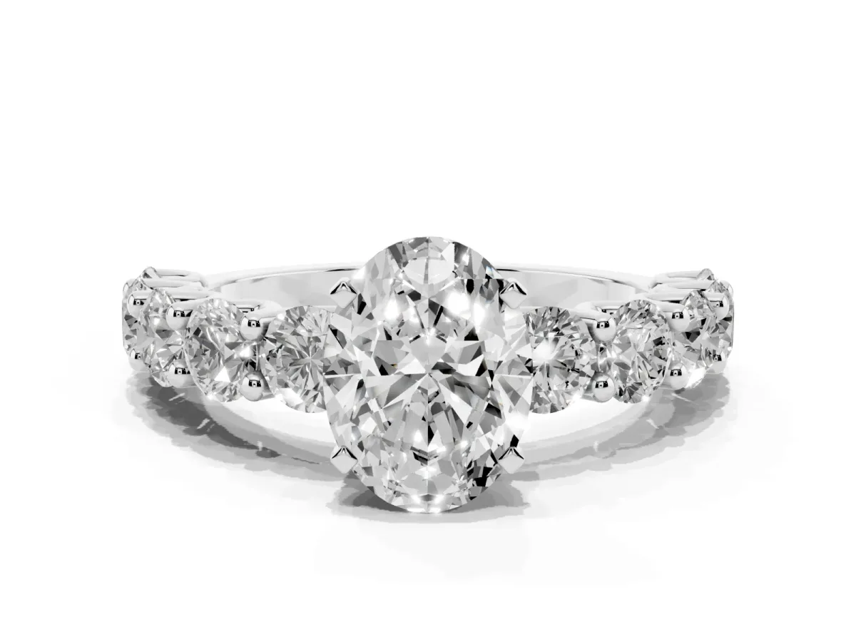 Oval Cut Diamond Prong Setting with Side Stones on a Pave Band Silver