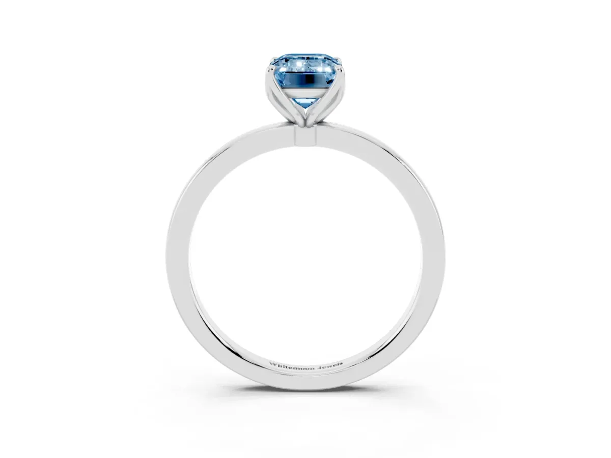 Fancy Blue Emerald Cut Diamond Solitaire Ring with Thin Band and Prong Setting Silver
