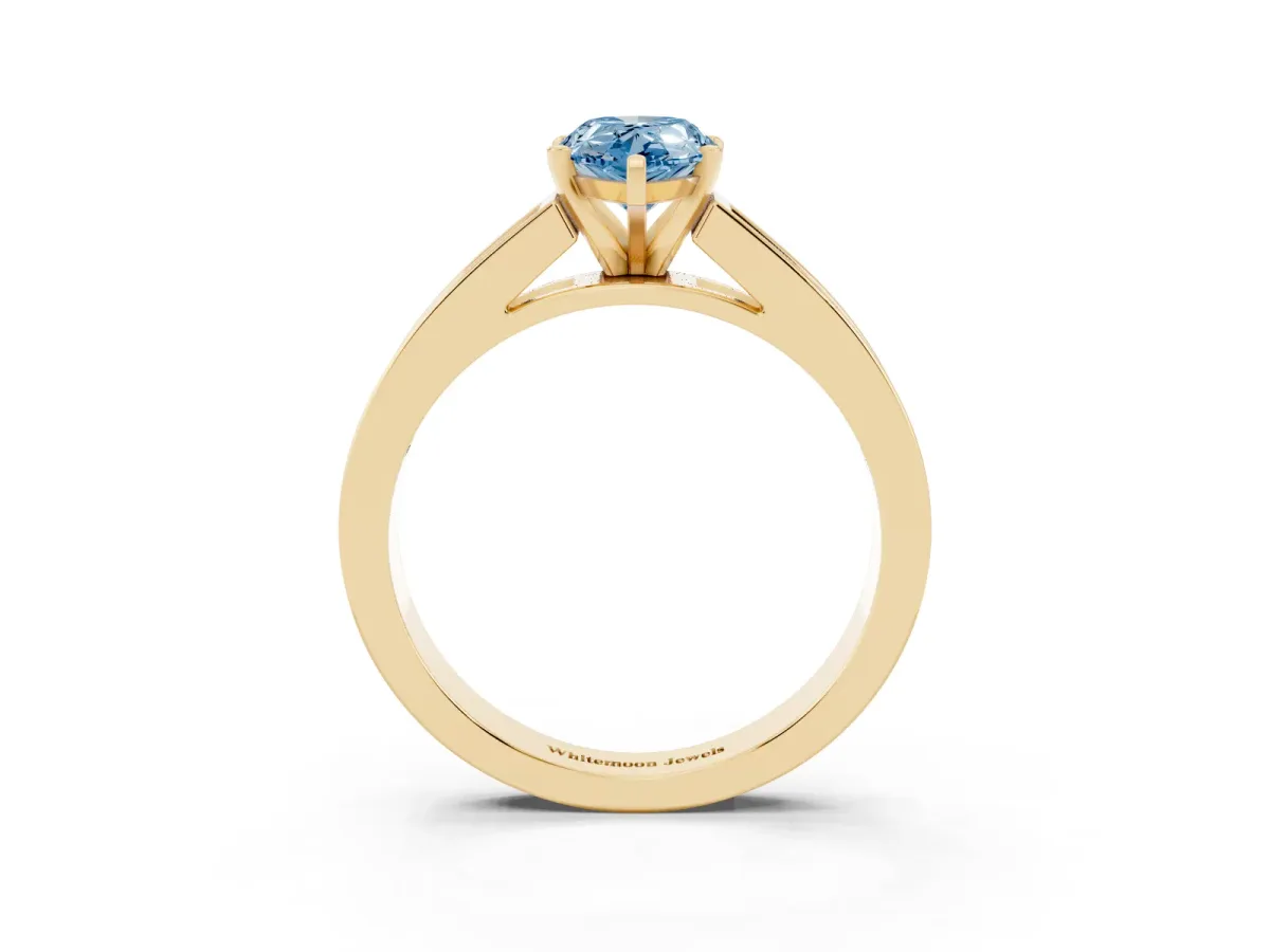 Fancy Blue Pear Cut Solitaire Diamond Ring with Channel-Set Band and Four-Prong Setting Yellow gold