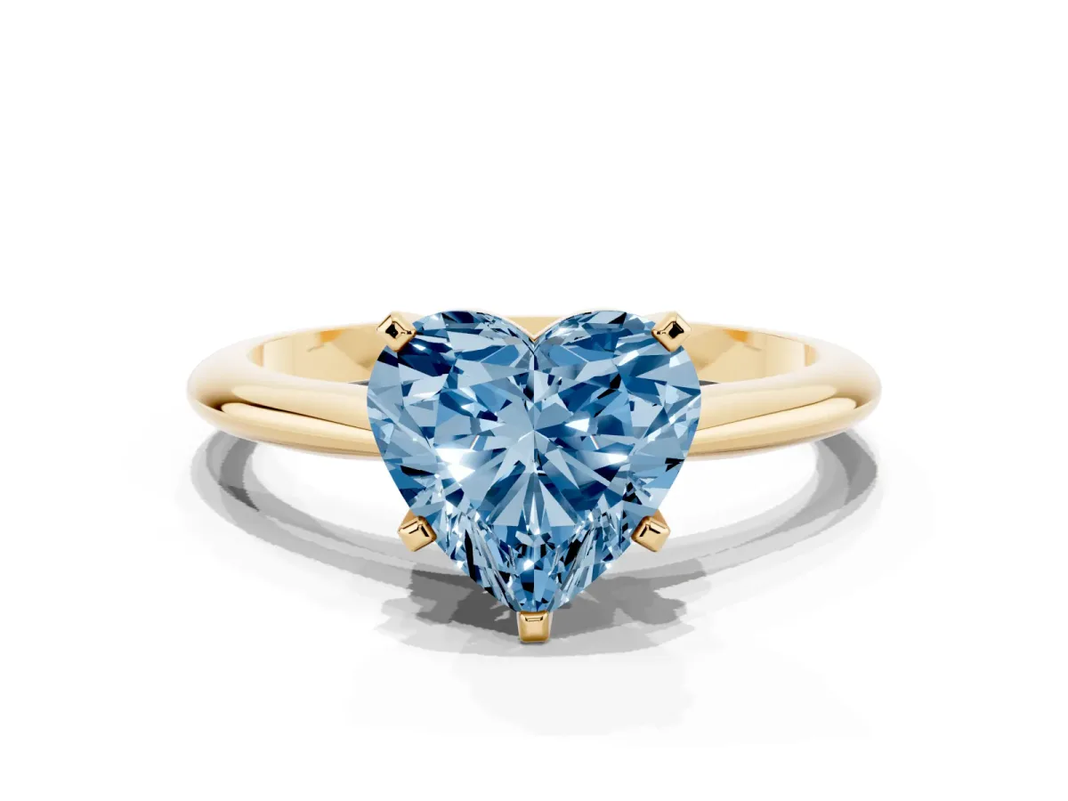 Fancy Blue Heart Cut Cut Solitaire Ring with Four-Prong Setting on a Classic Band Yellow gold