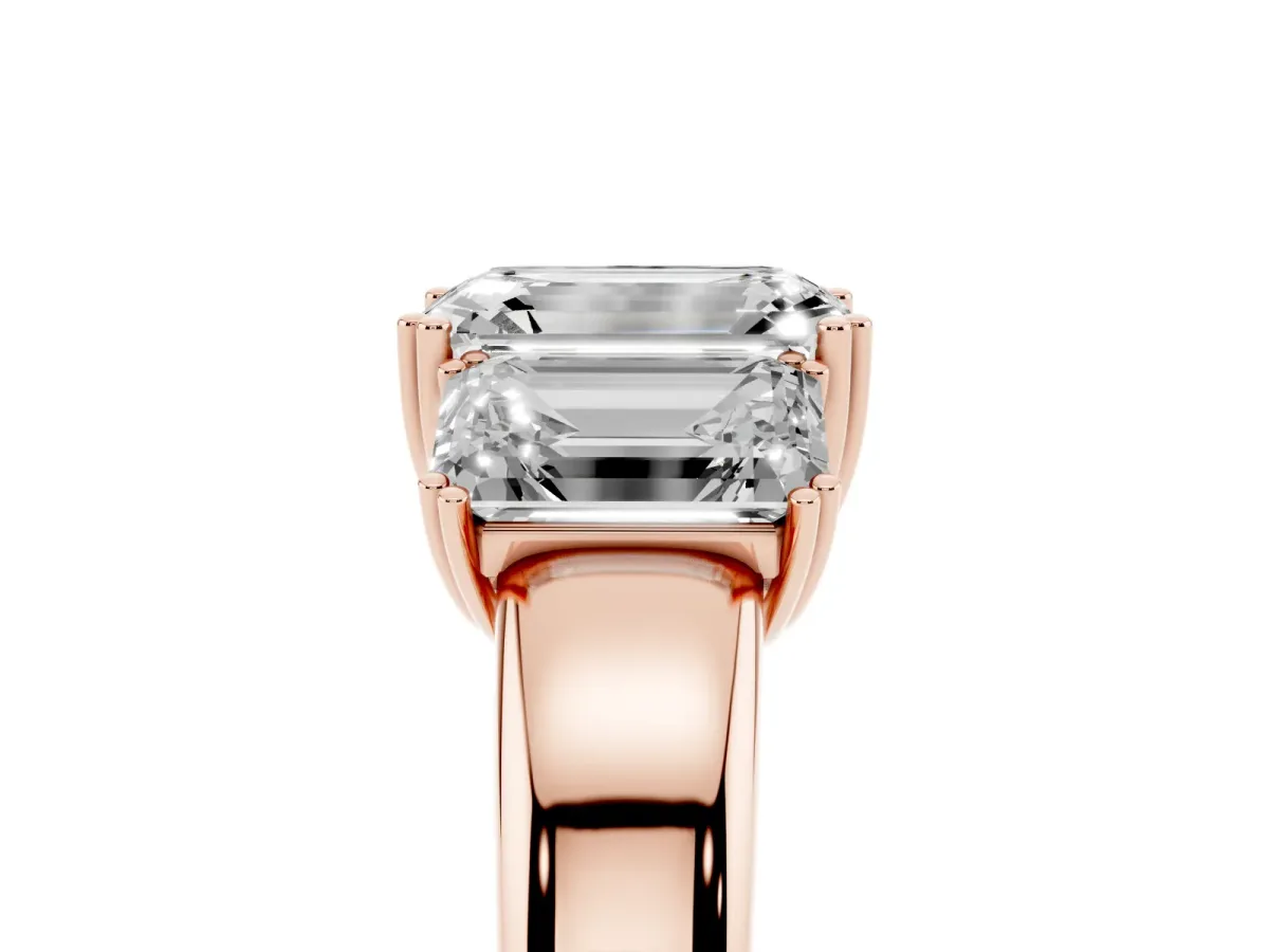 Three-Stone Emerald Cut Cut Diamond Ring with Channel Set Band and Four-Prong Setting Rose gold