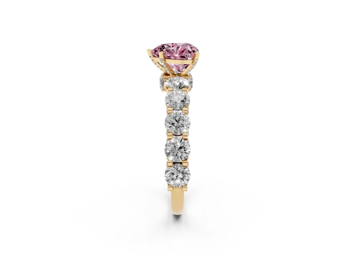 Fancy Pink Heart Cut Diamond Side Stone Engagement Ring with Four-Prong Setting Yellow gold