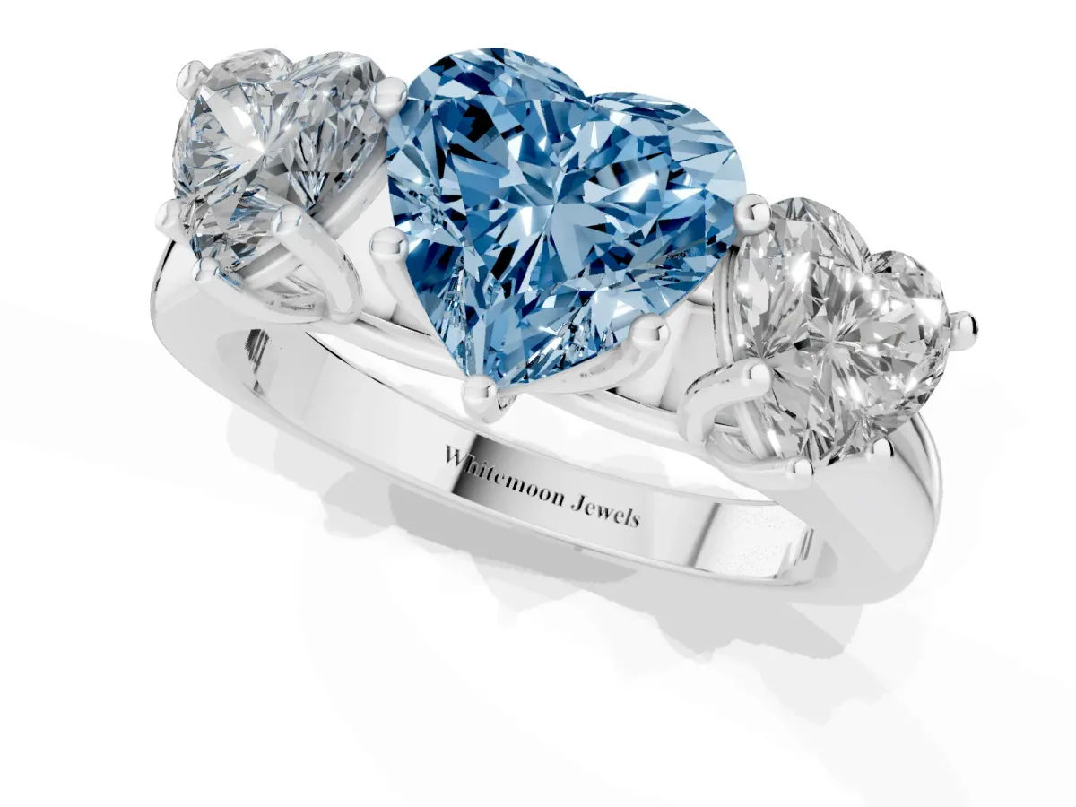 Fancy Blue Heart Cut Three-Stone Diamond Ring with Prong Setting on a Classic Band Platinum