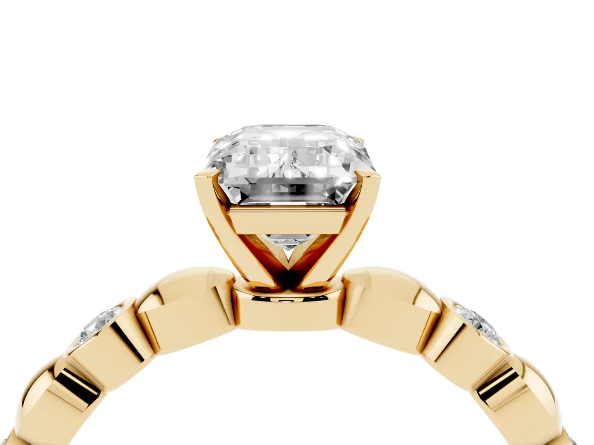 Emerald Cut Solitaire Bezel-Set Diamond Ring with Beaded Band and Four-Prong Setting Yellow gold